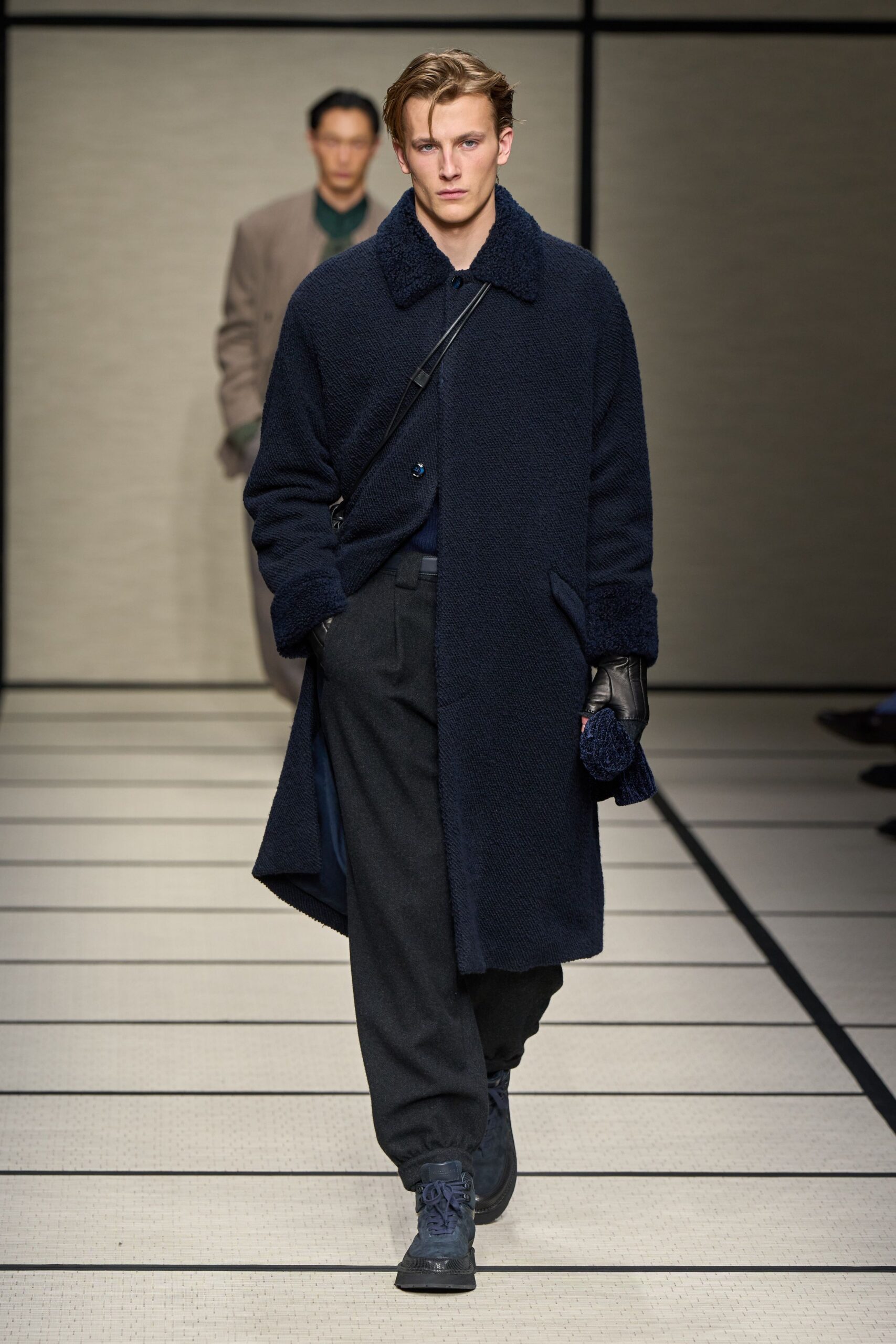 blue wool coat with gray pants