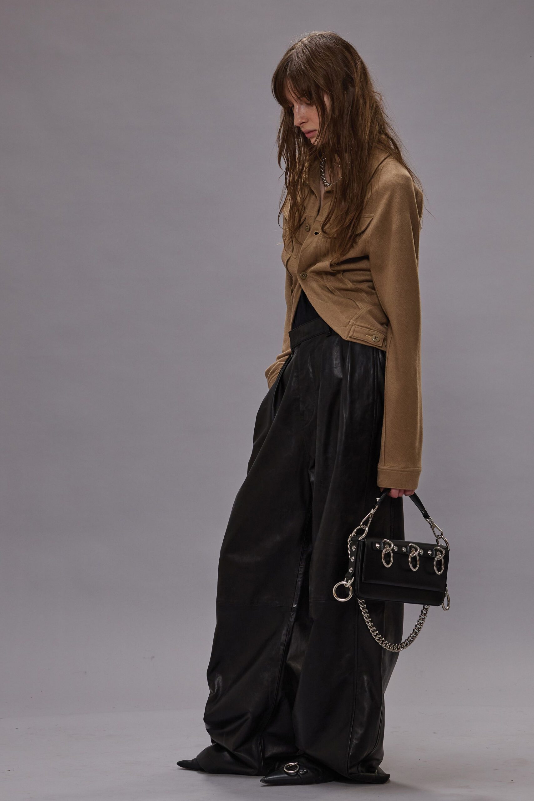beige jacket black leather pants