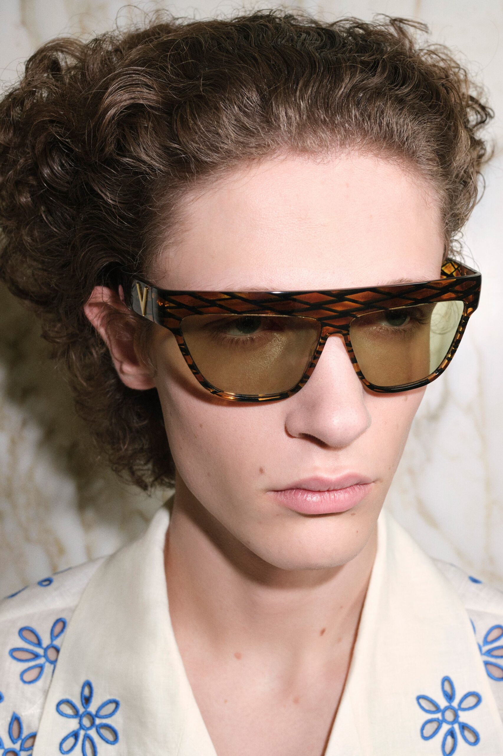 relaxed white embroidered shirt with sunglasses
