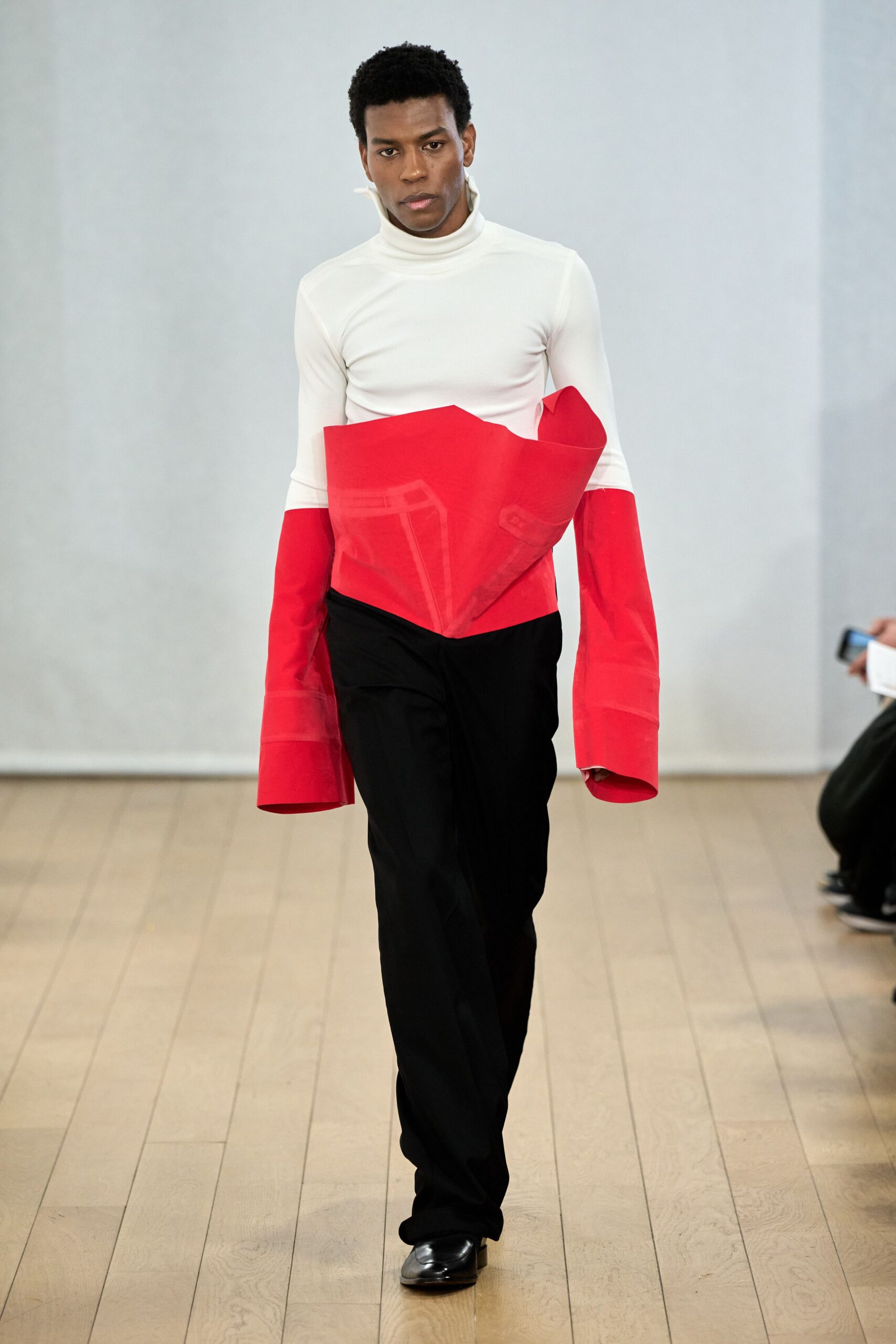 fitted white and red top with black pants