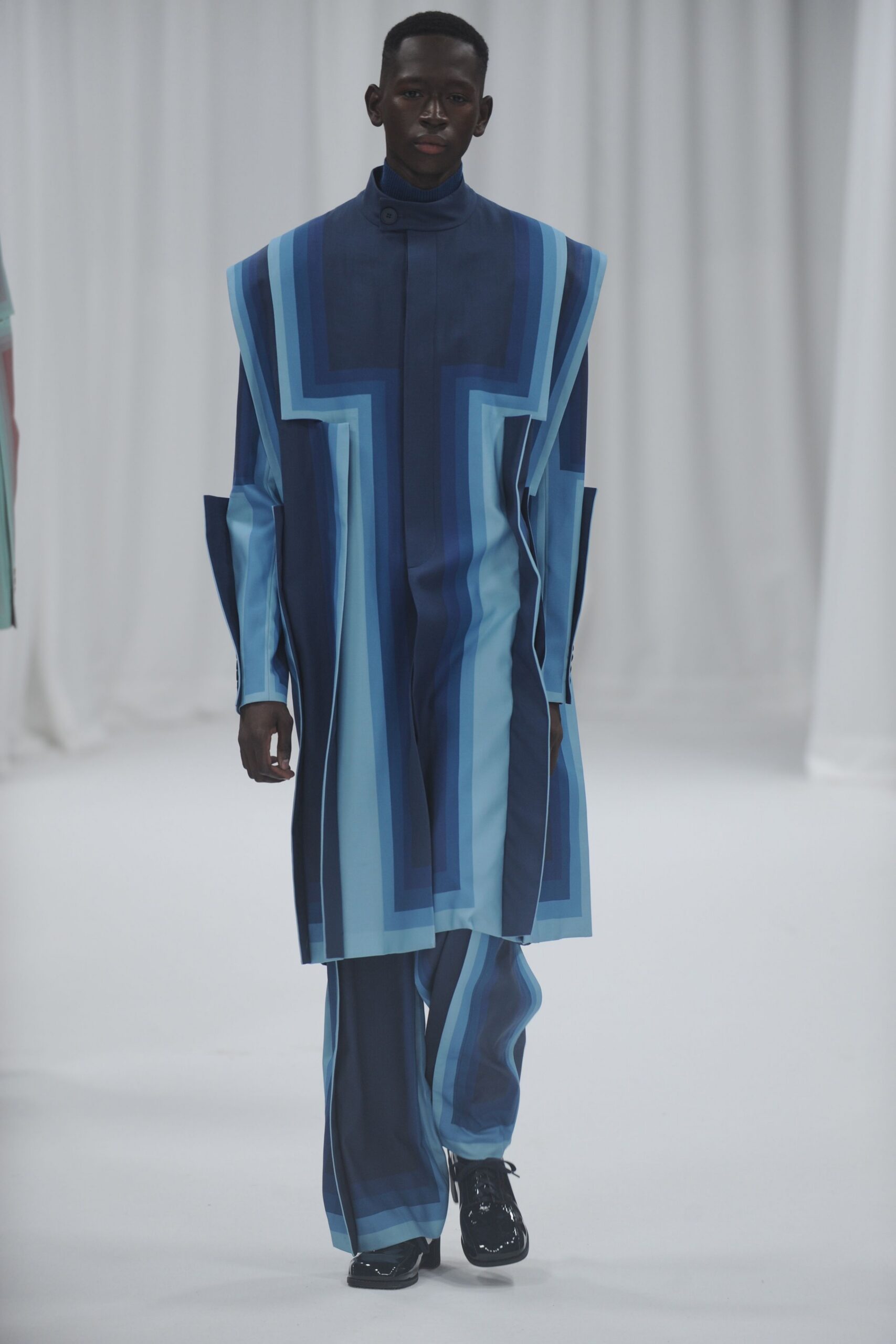 blue color-blocked jumpsuit with black shoes