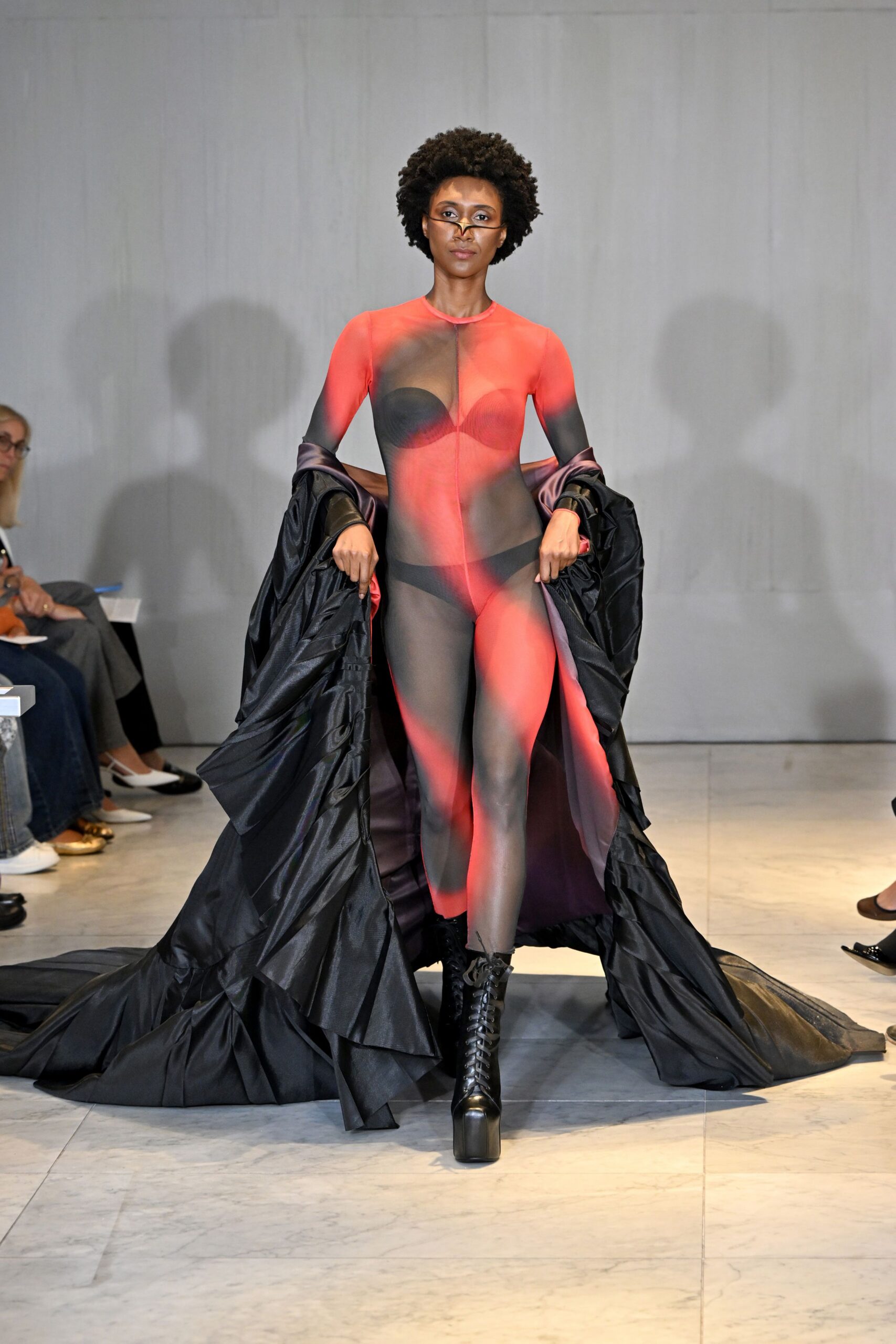 black and red mesh catsuit with cape