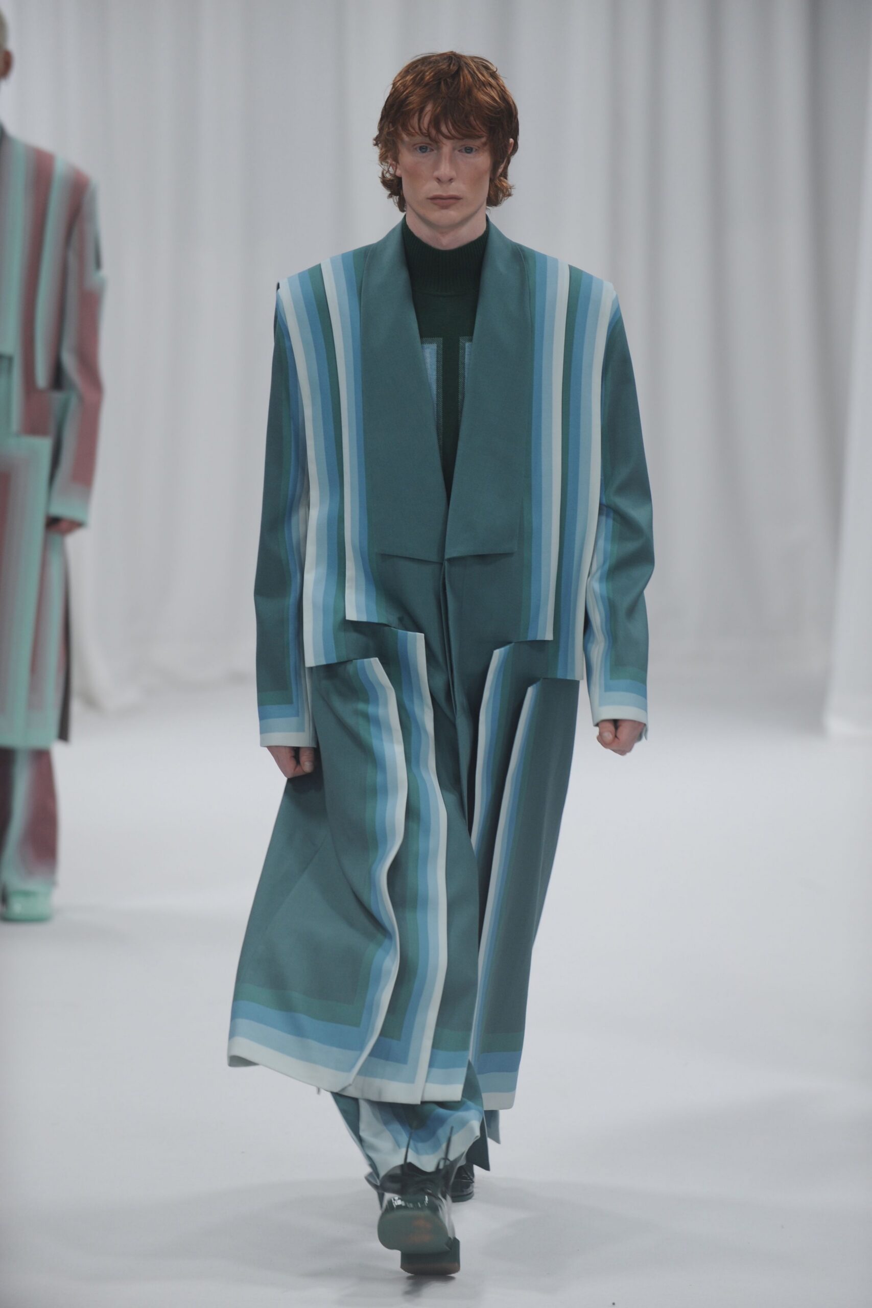 teal striped coat with black top