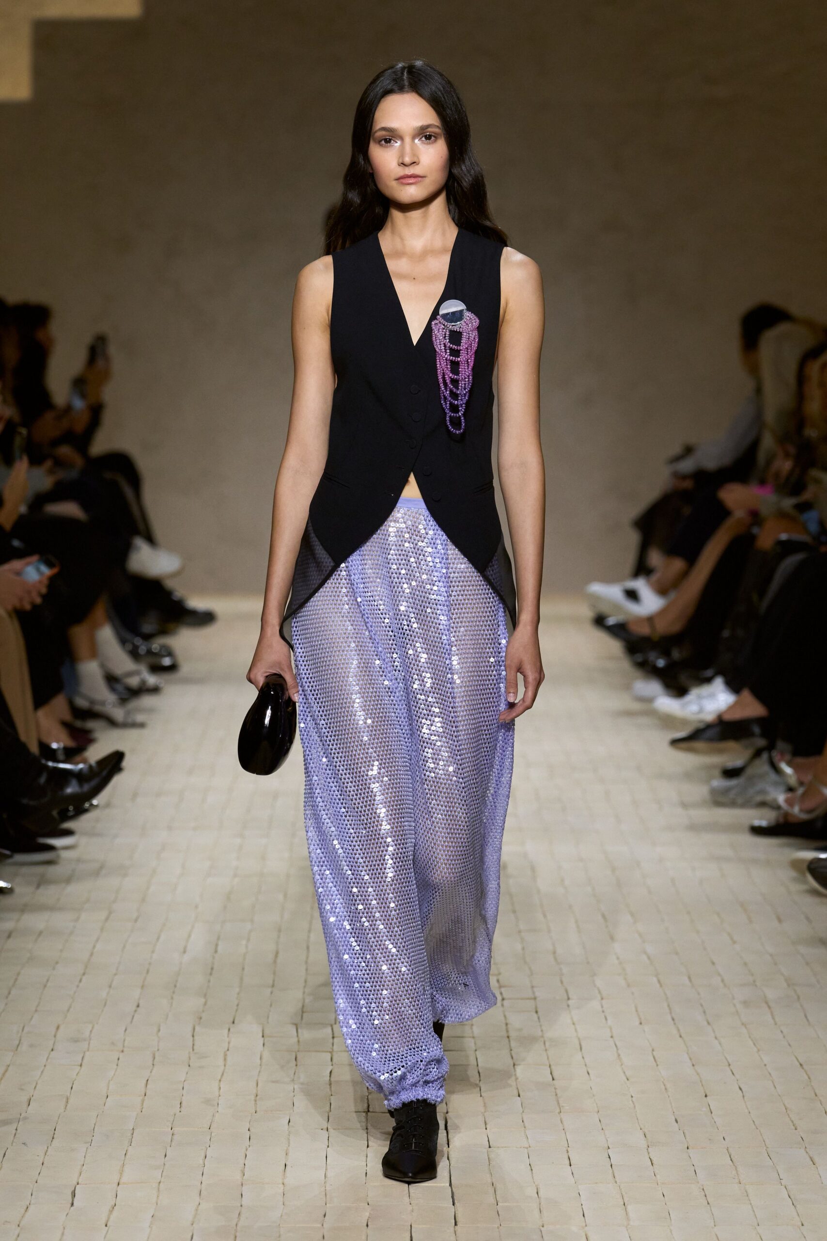 black fitted vest with sequined pants
