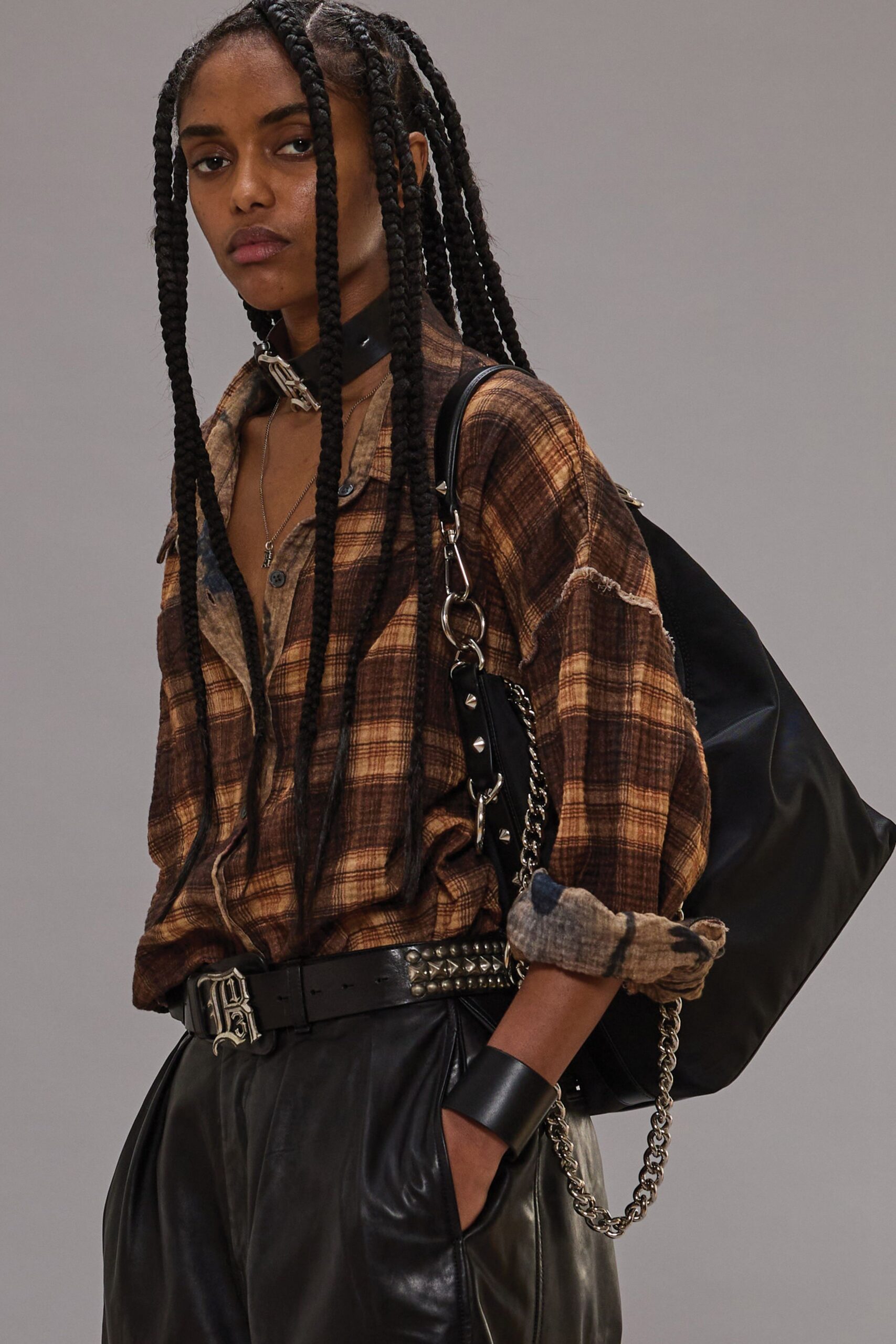 brown checked shirt with black leather pants