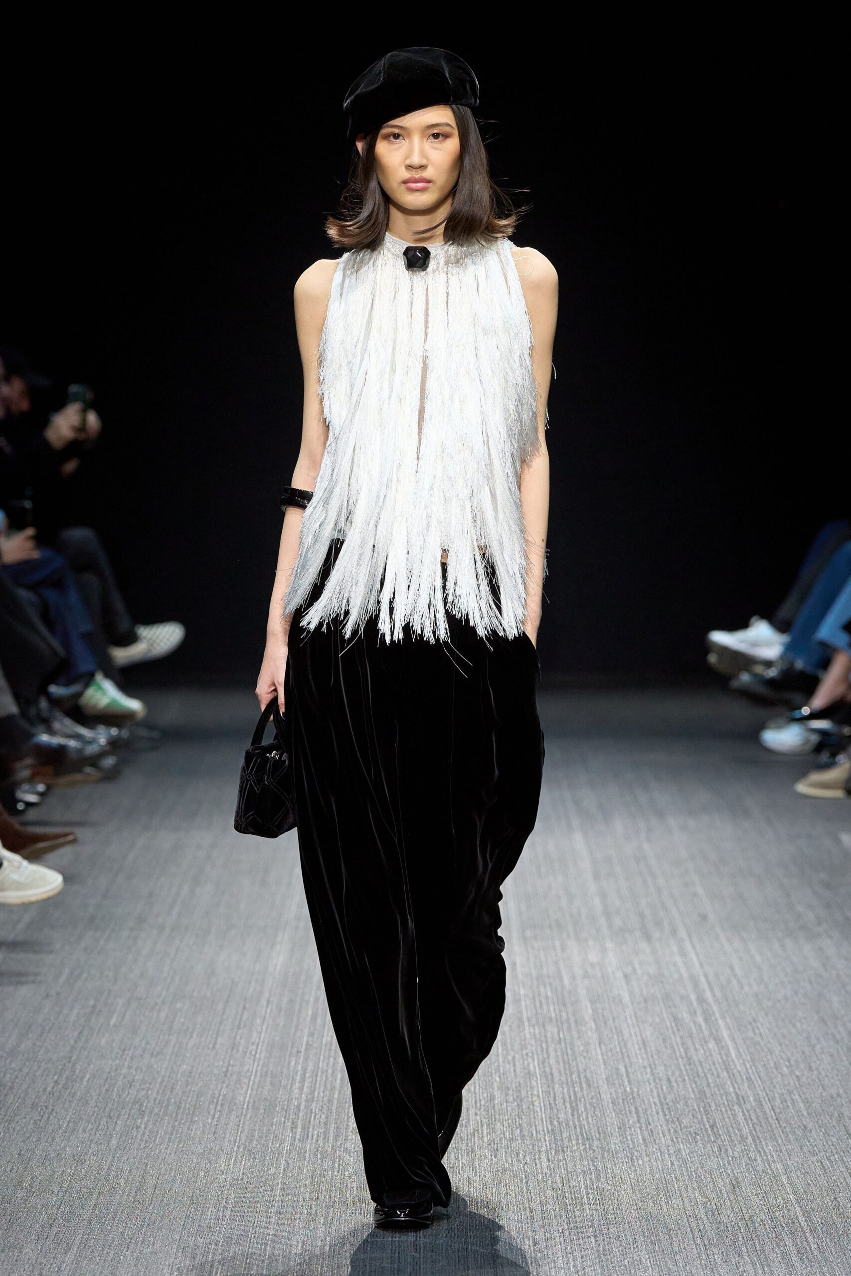 white fringed top with black pants