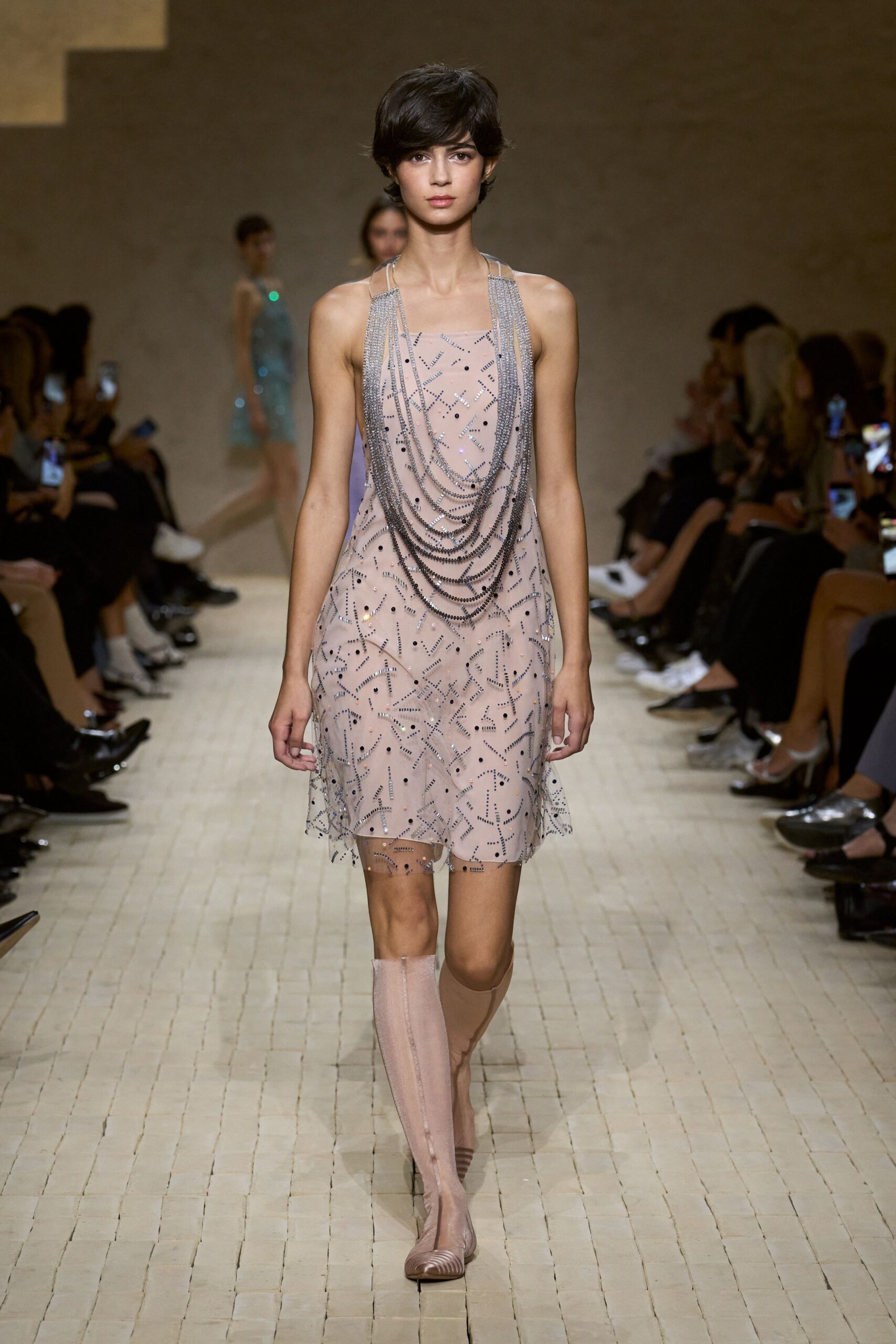 pink beaded mini dress with beige boots