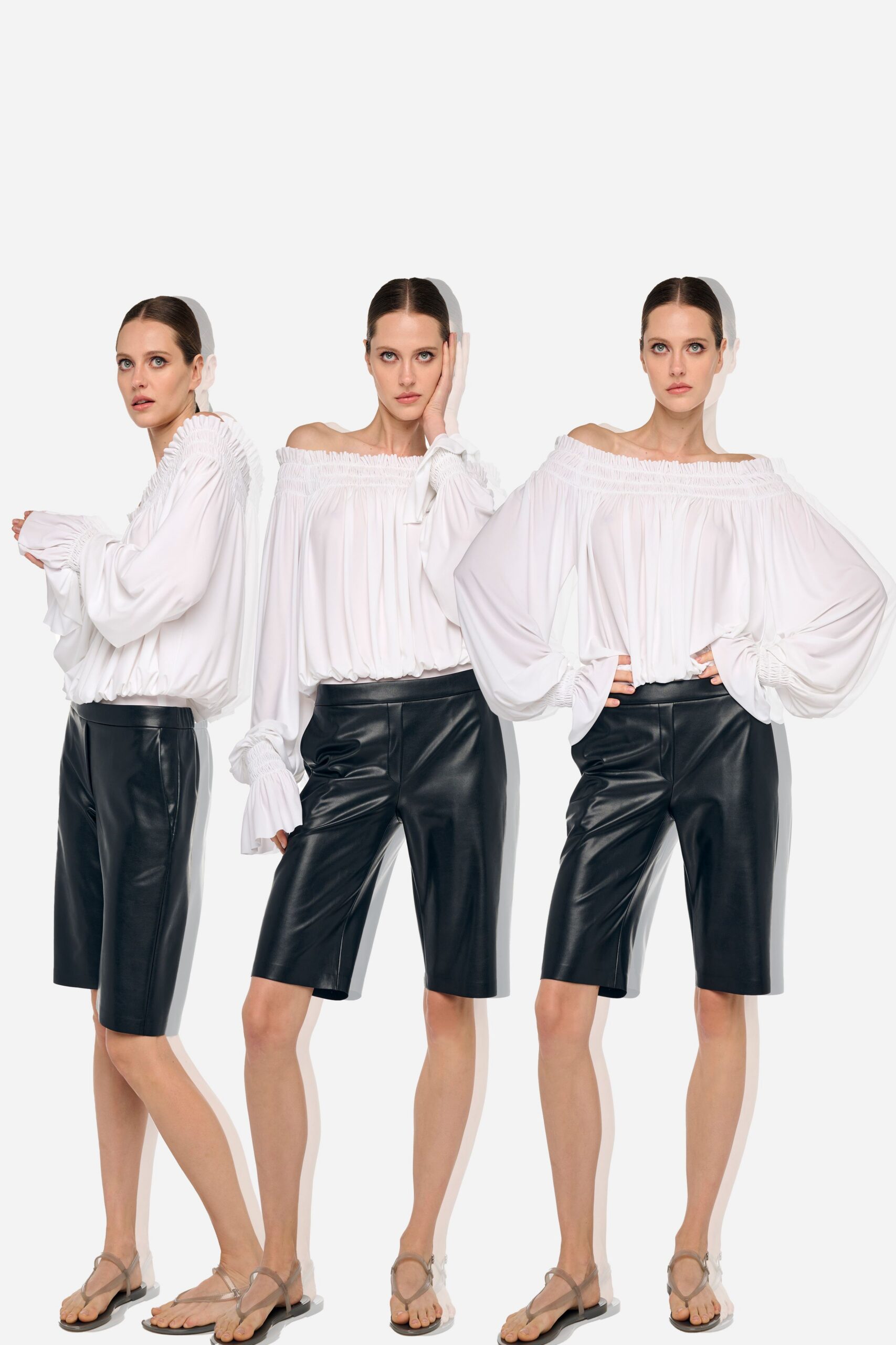white relaxed blouse with black leather shorts
