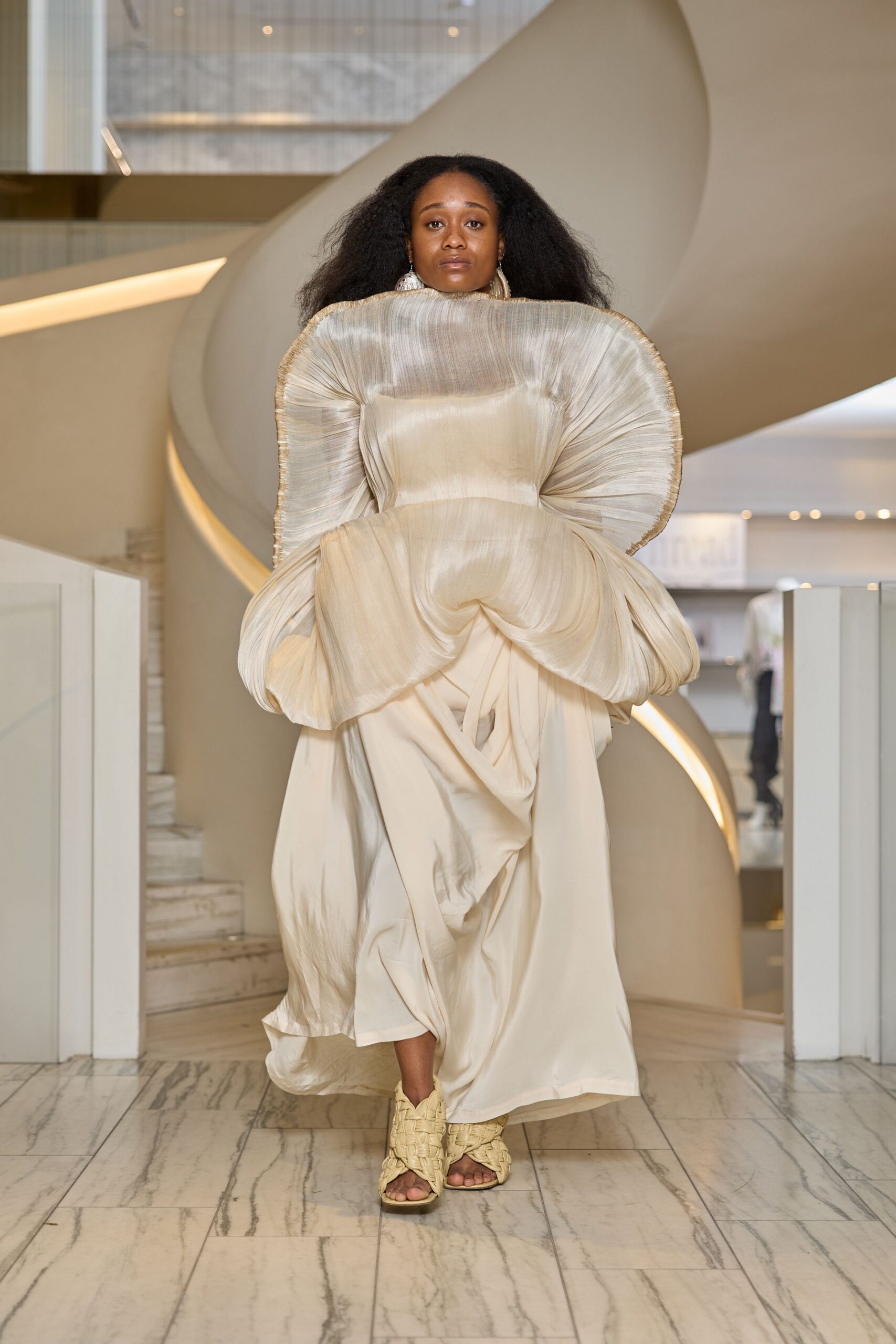 ivory silk draped gown with textured shoes