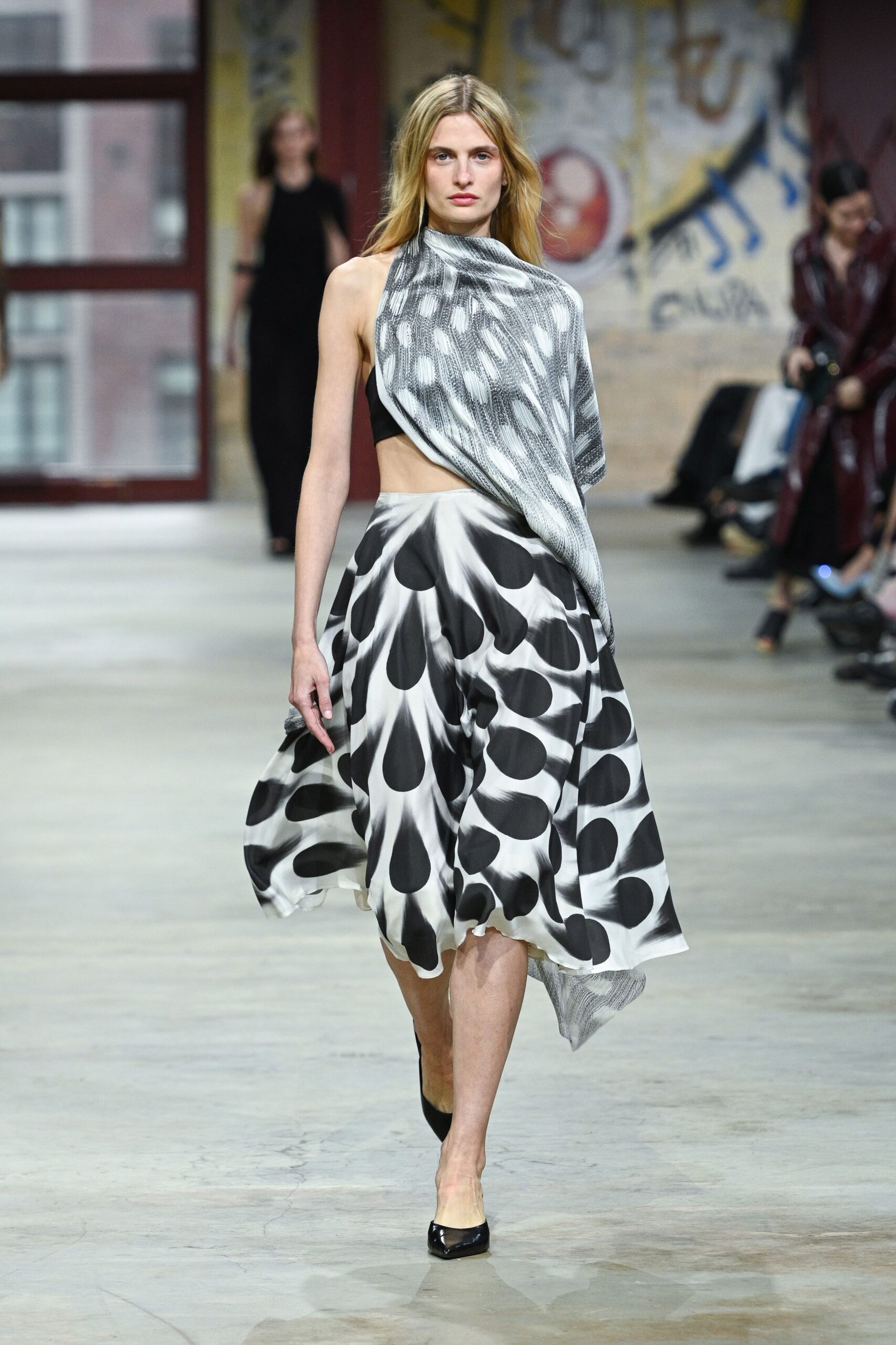 black silk sleeveless high-neck fitted draped flowing top