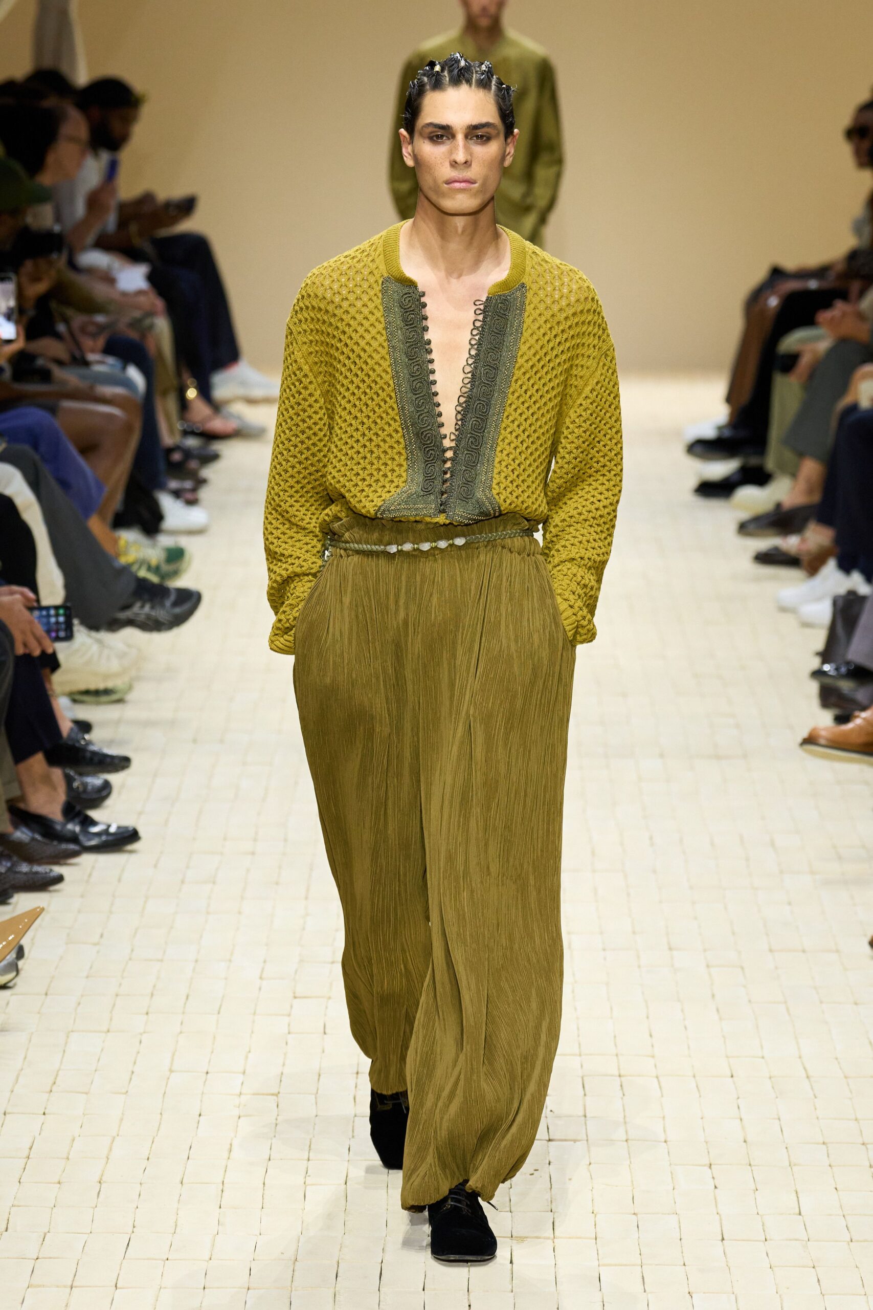 green relaxed shirt with beige pants