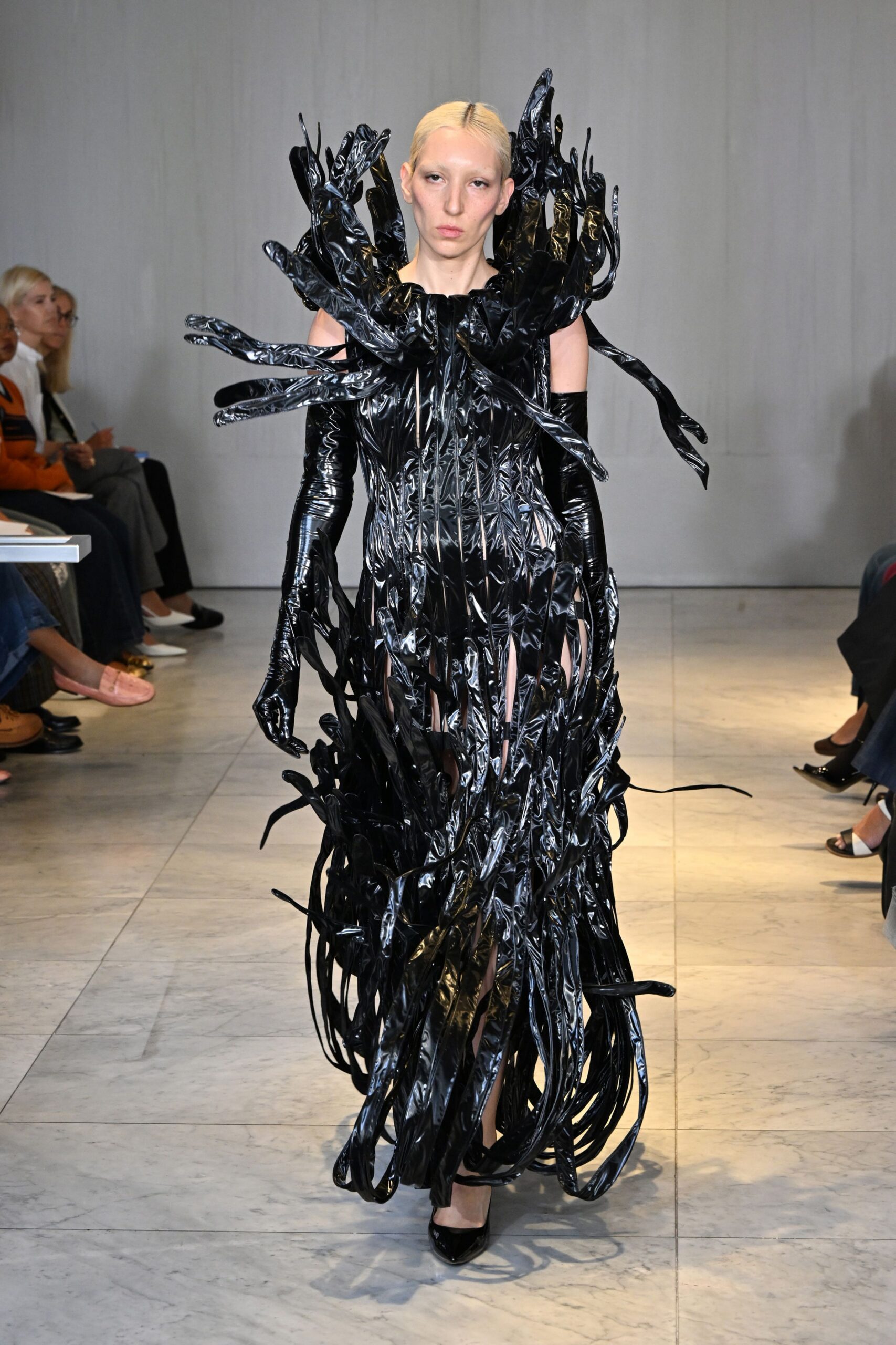 black vinyl sleeveless fitted layered fringed shiny gown