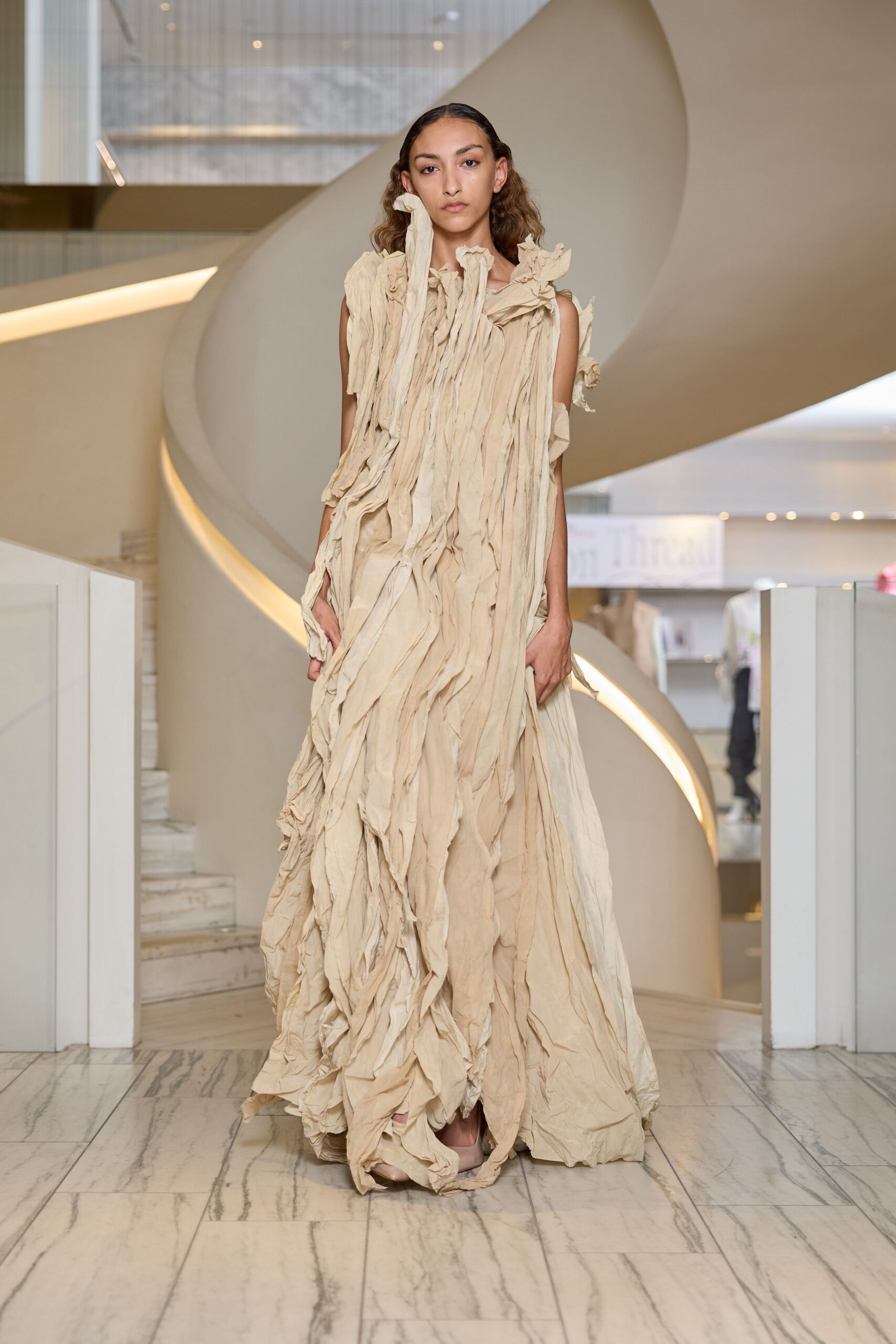 beige draped sleeveless gown