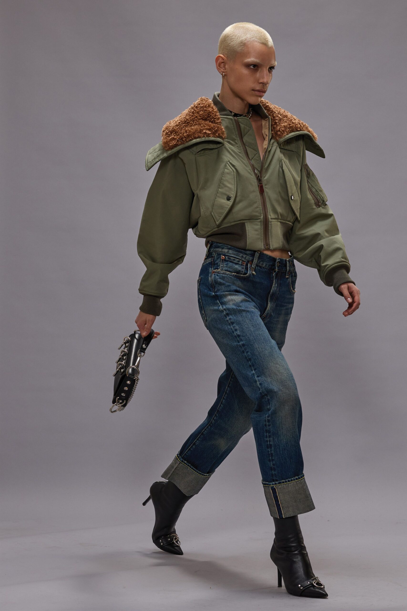 green relaxed jacket with denim pants