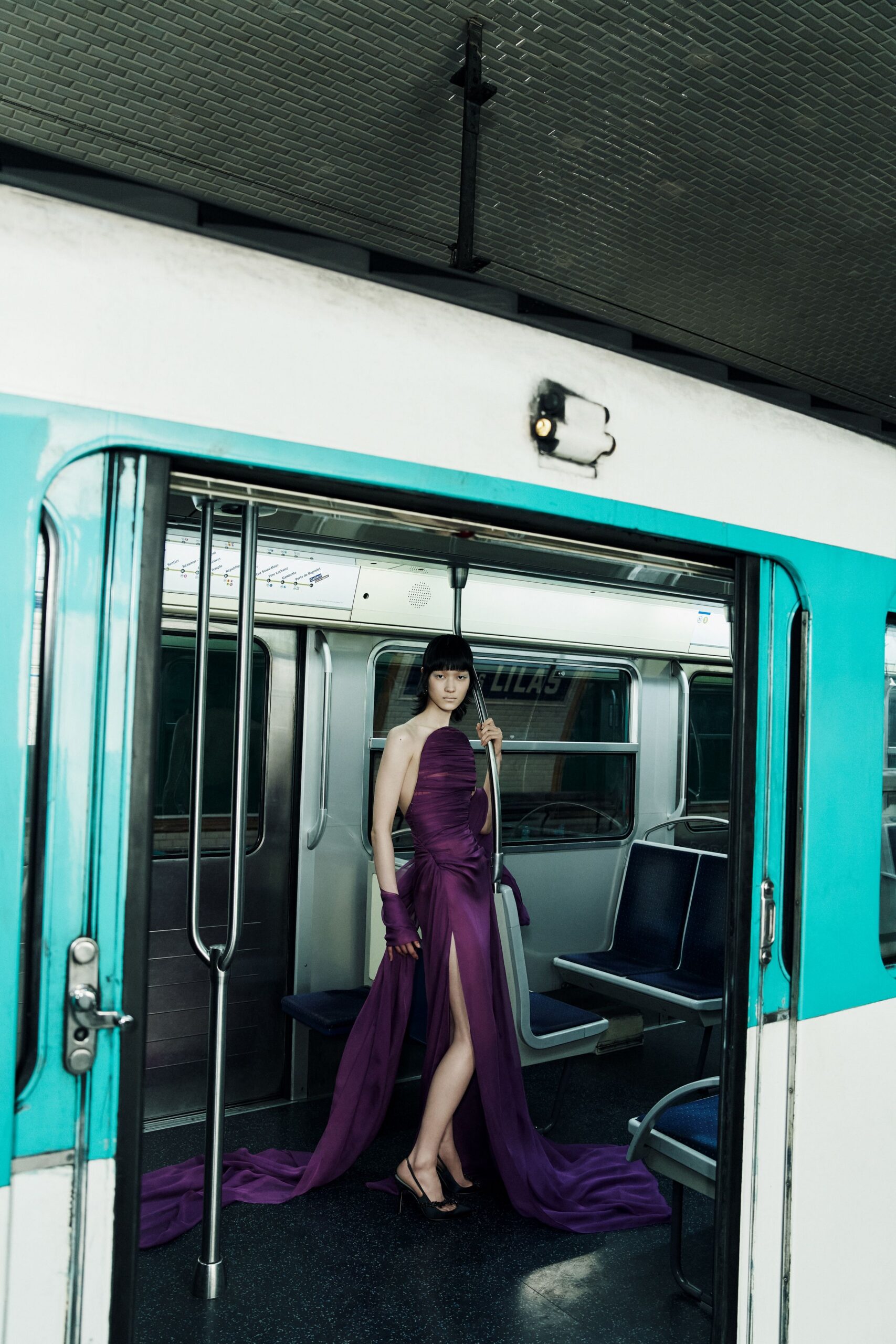 purple silk sleeveless v-neck fitted draped flowing gown