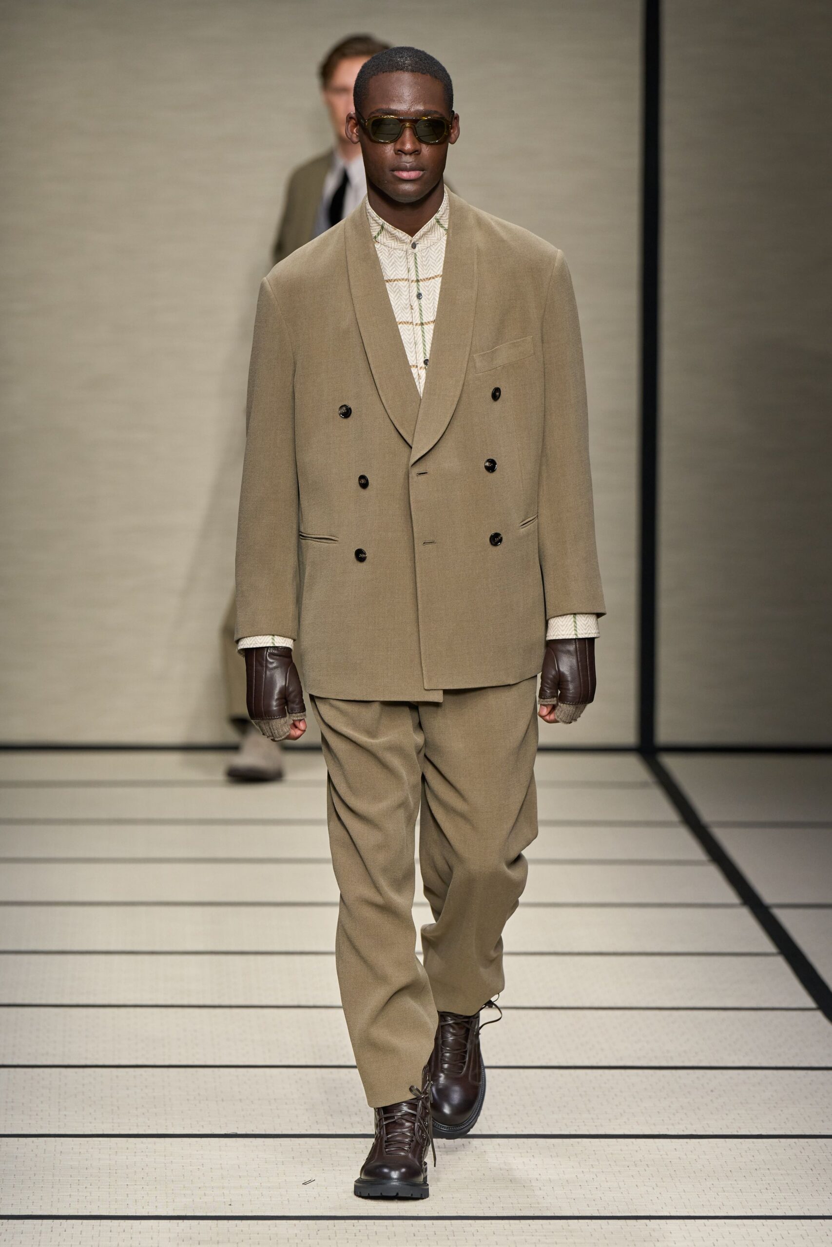 beige tailored suit with gloves