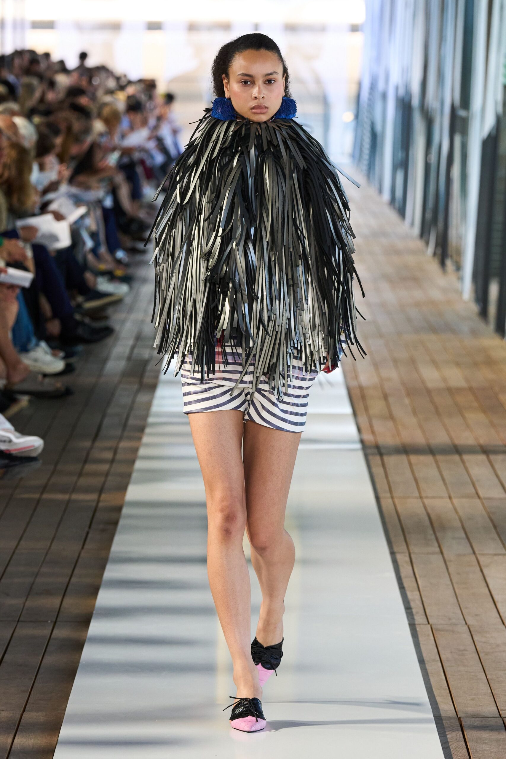 fringed black and white top with striped shorts