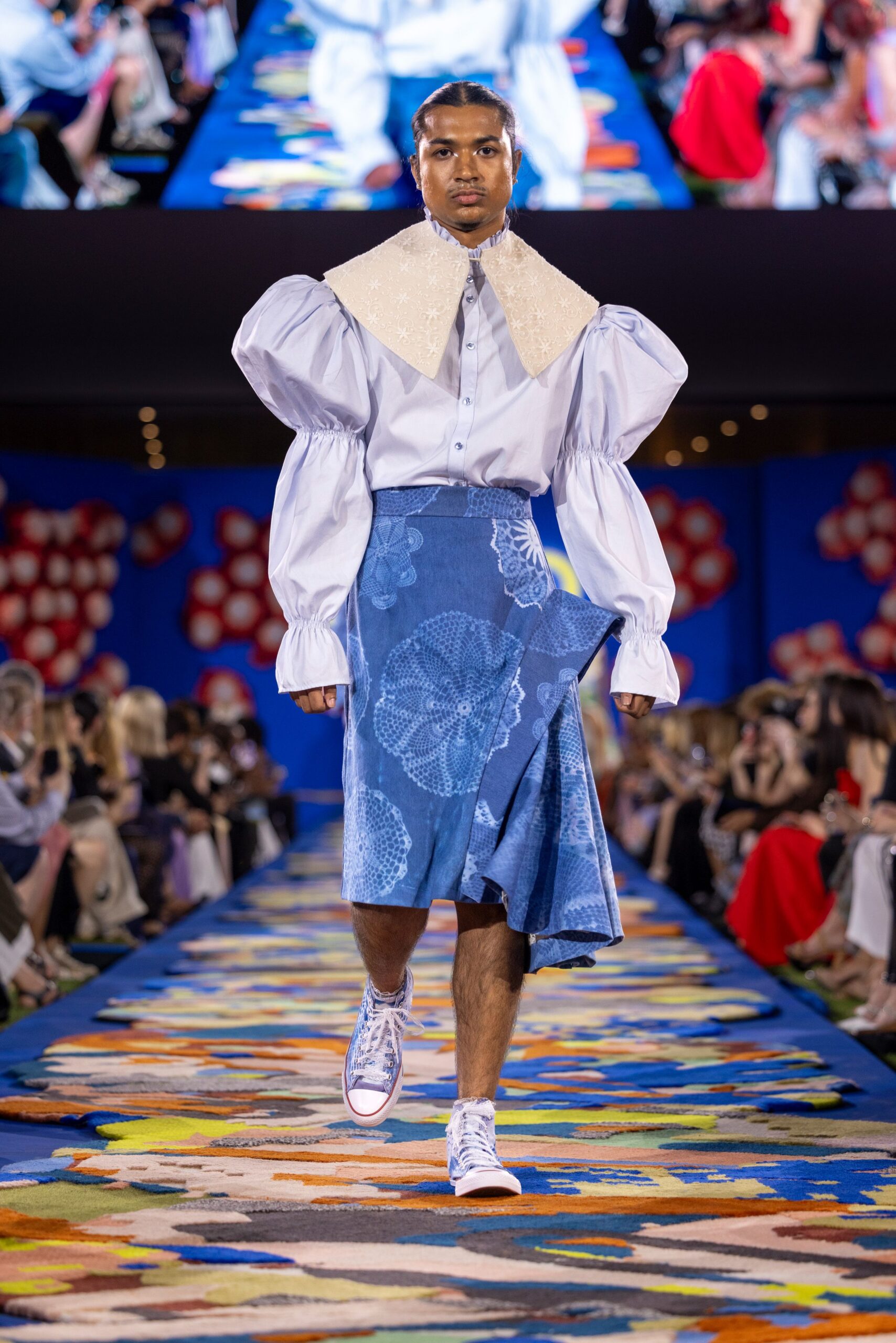 white relaxed shirt with blue skirt