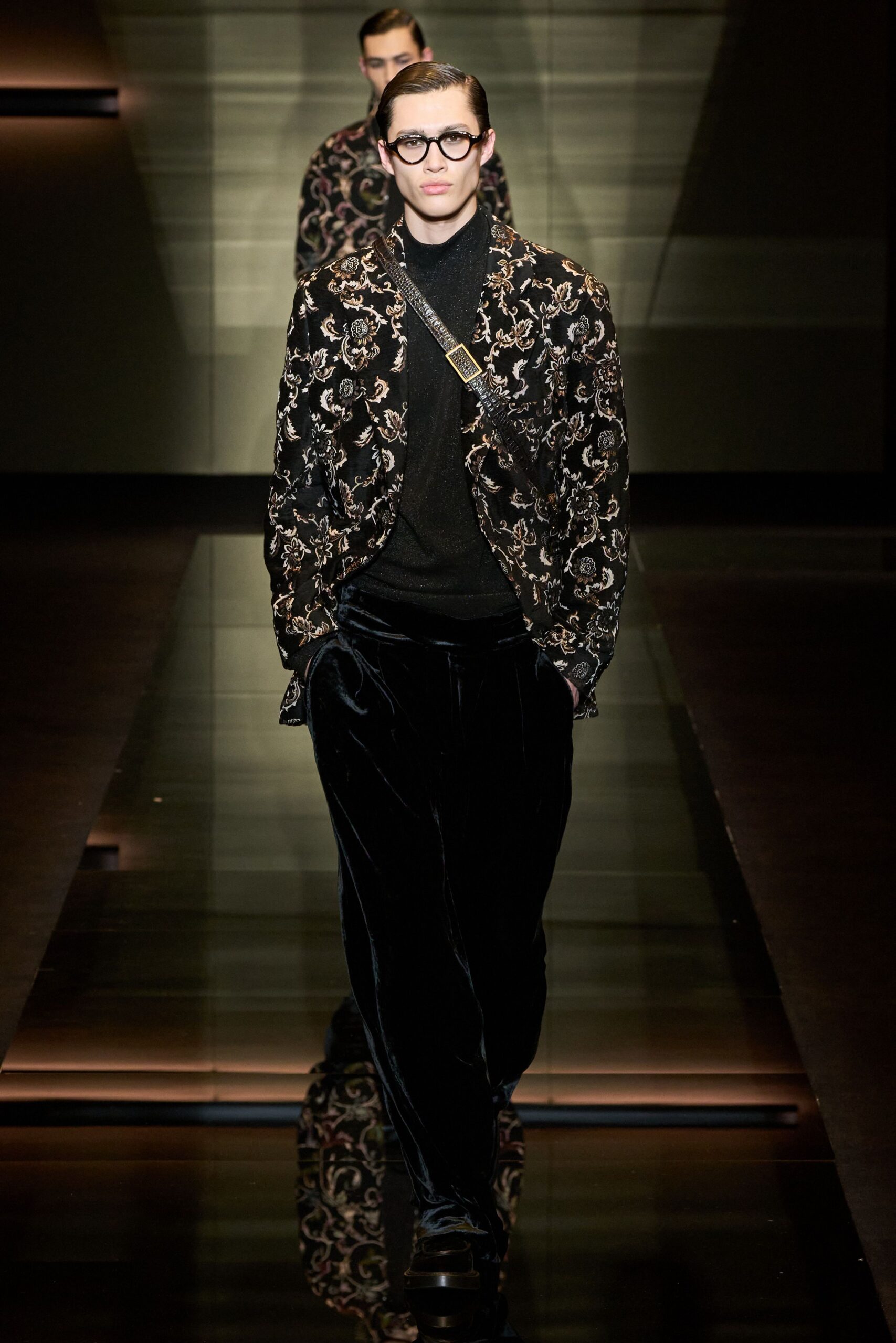 black embroidered jacket with sweater and velvet pants