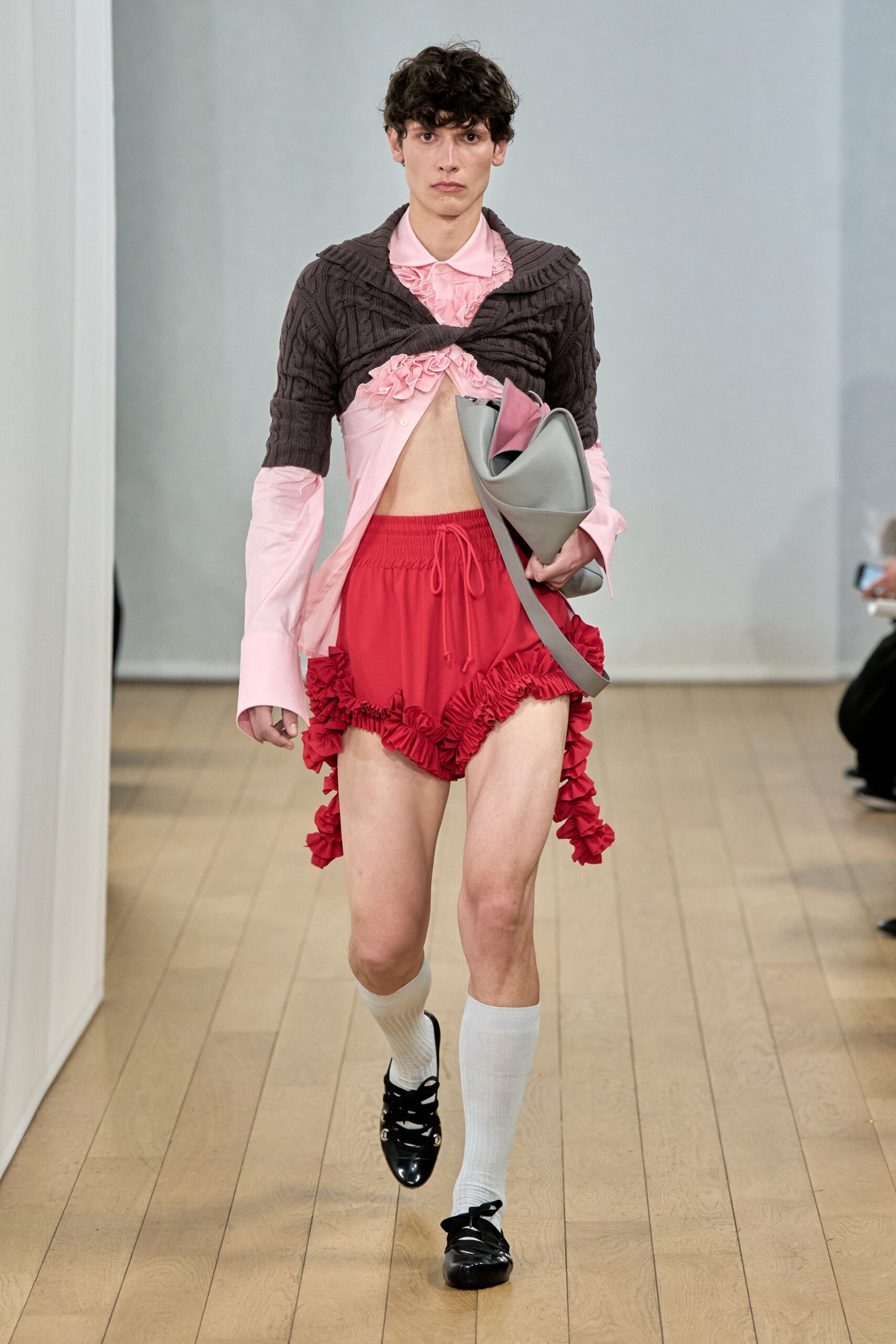 brown sweater pink shirt red skirt