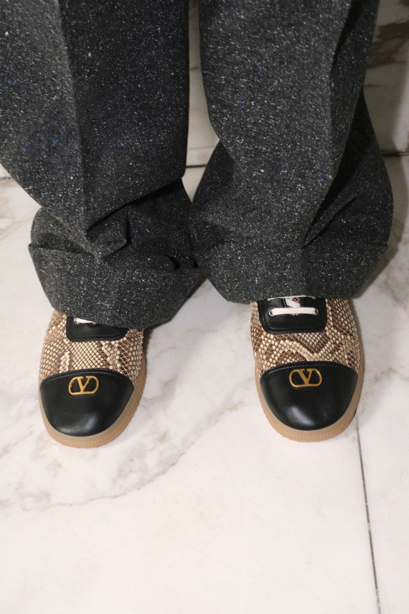 gray relaxed pants with textured shoes
