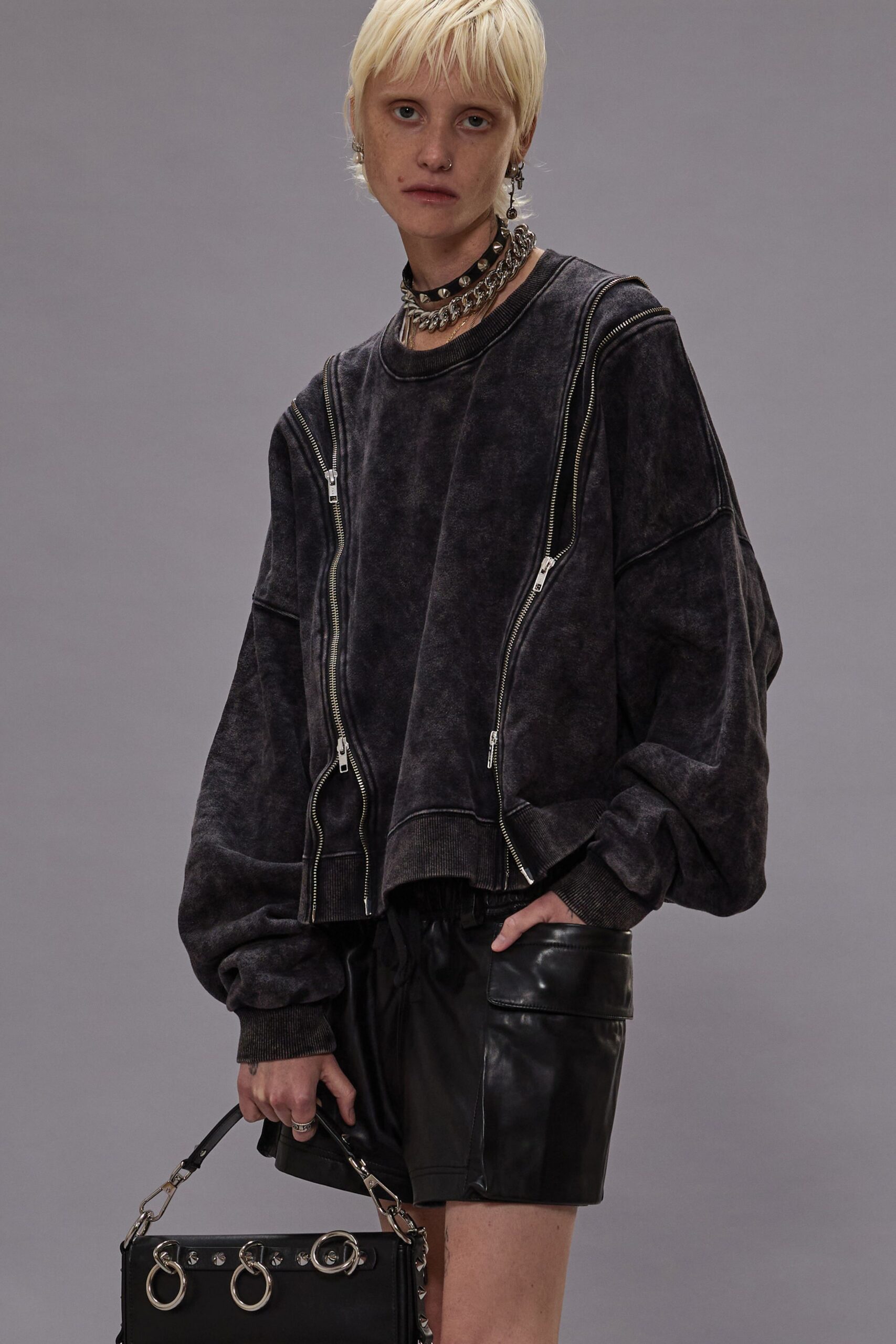black oversized top with leather shorts