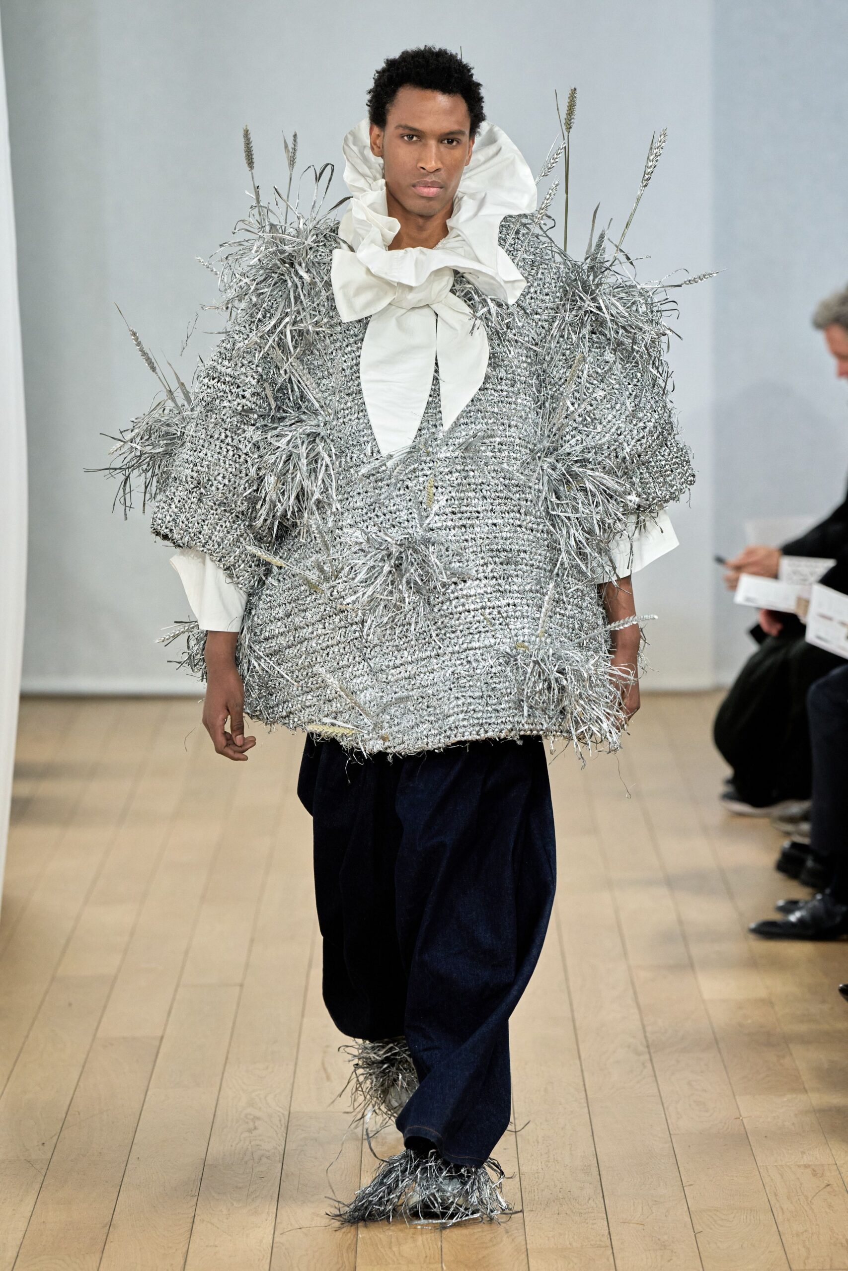 oversized silver top with relaxed denim pants