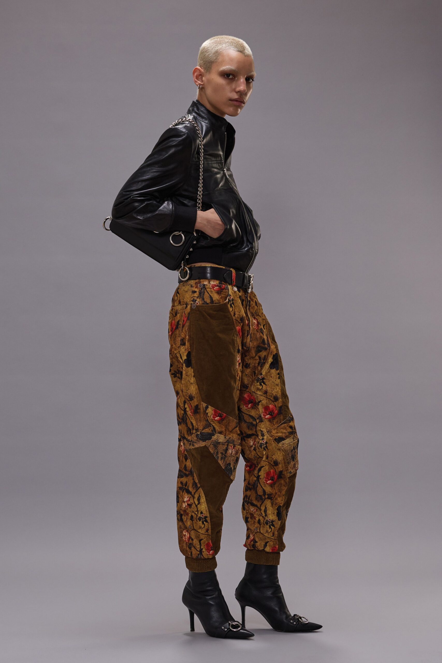 black leather jacket with patterned pants