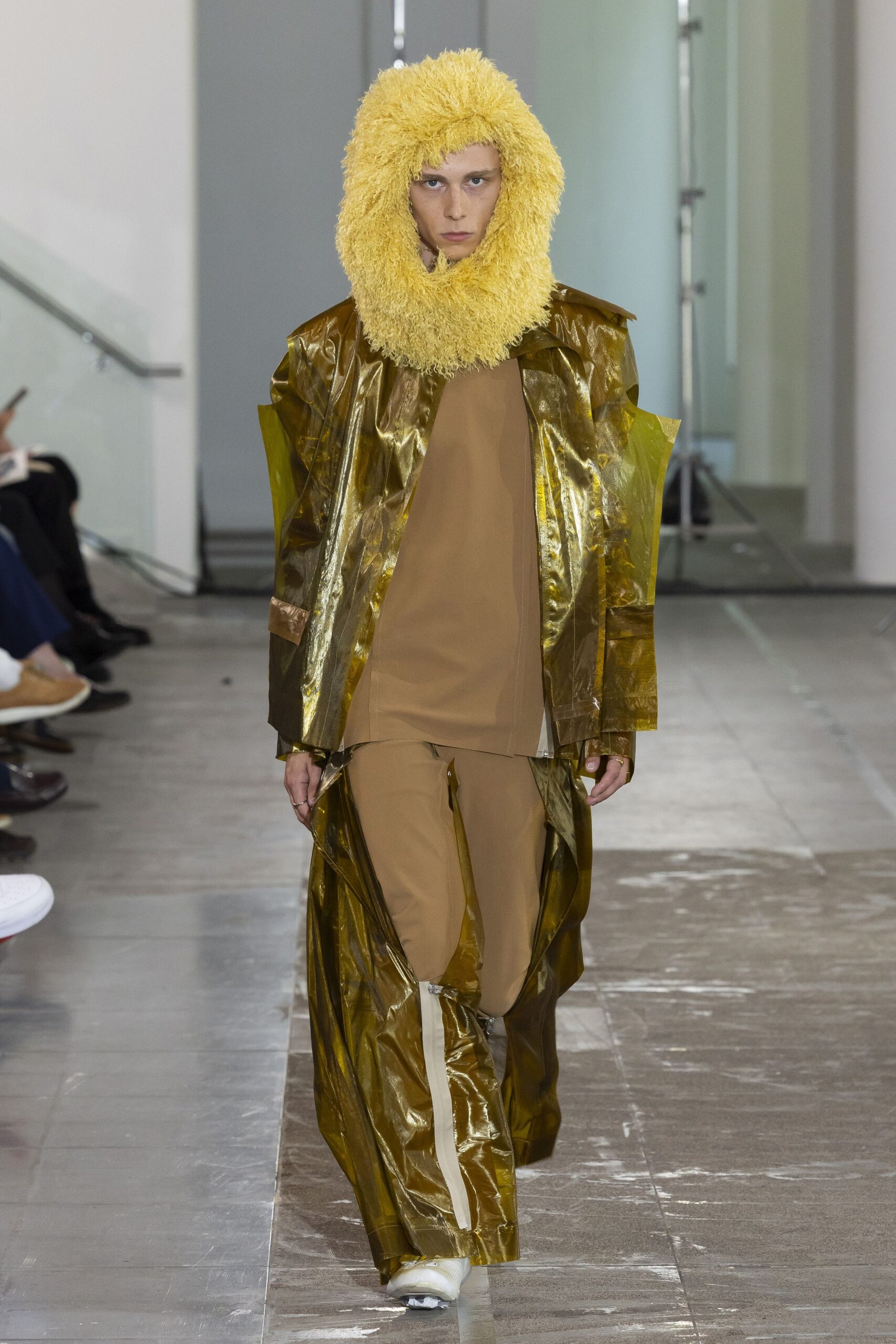 gold vinyl coat and brown top