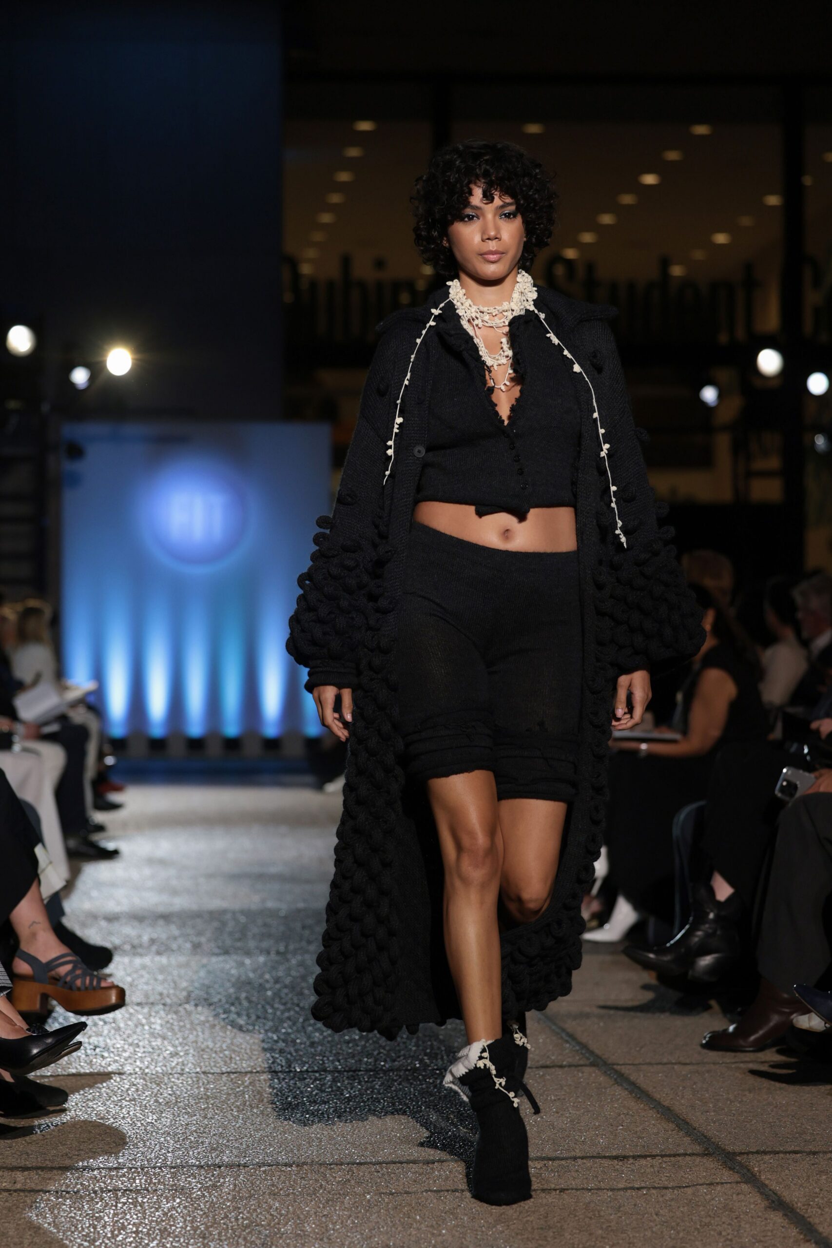 black knit coat and fitted top