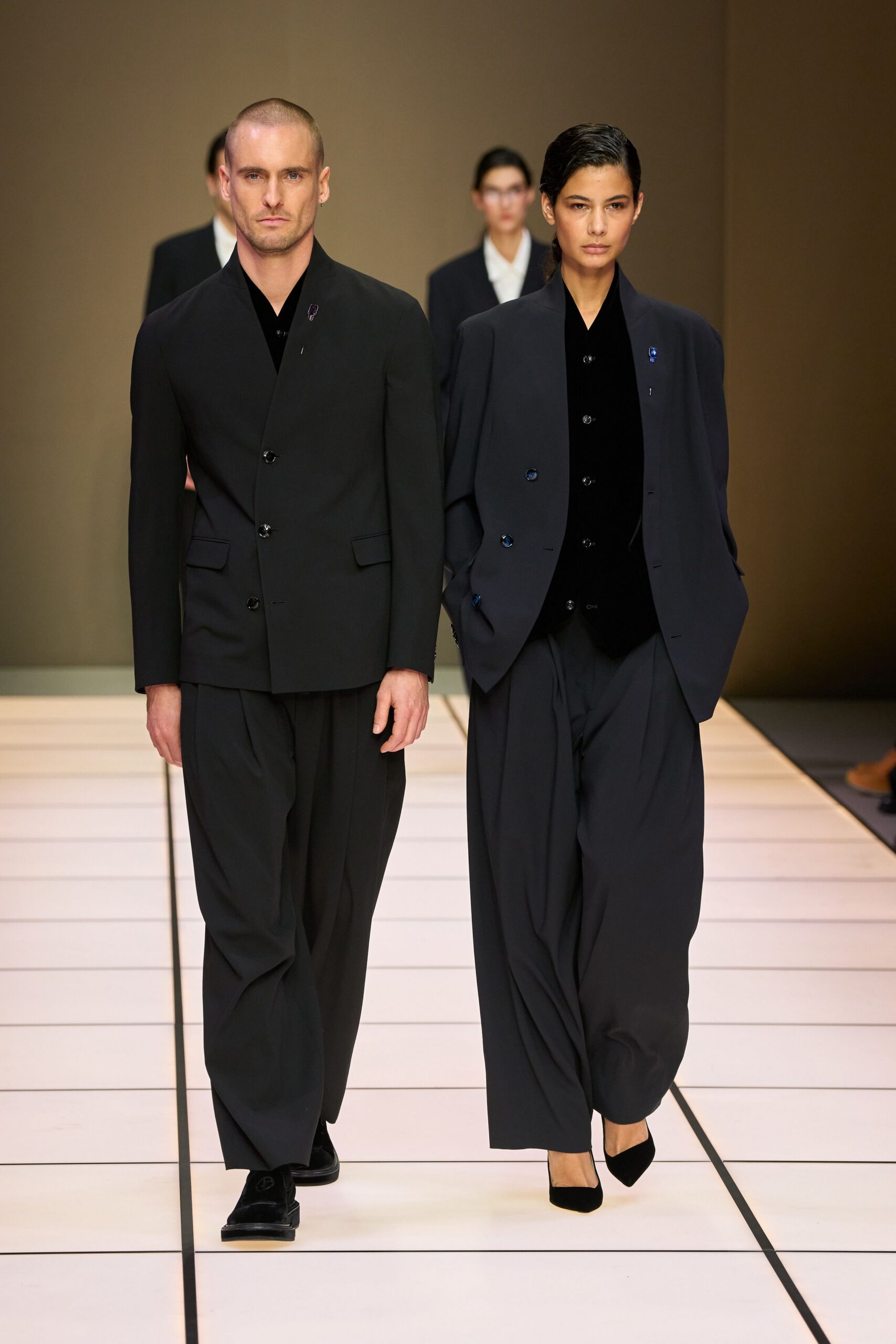 black structured blazers and relaxed pants