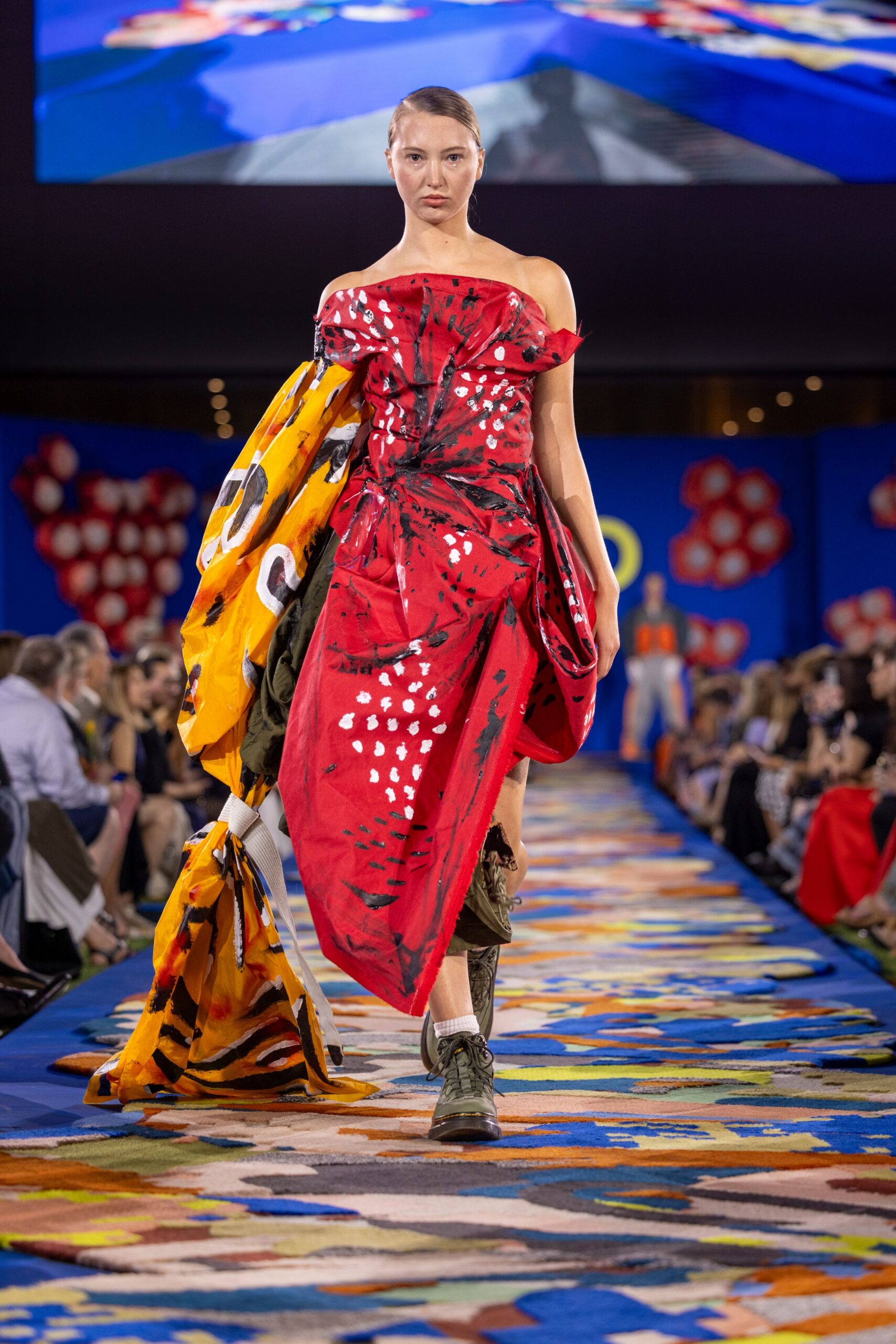 red off-shoulder maxi dress with boots