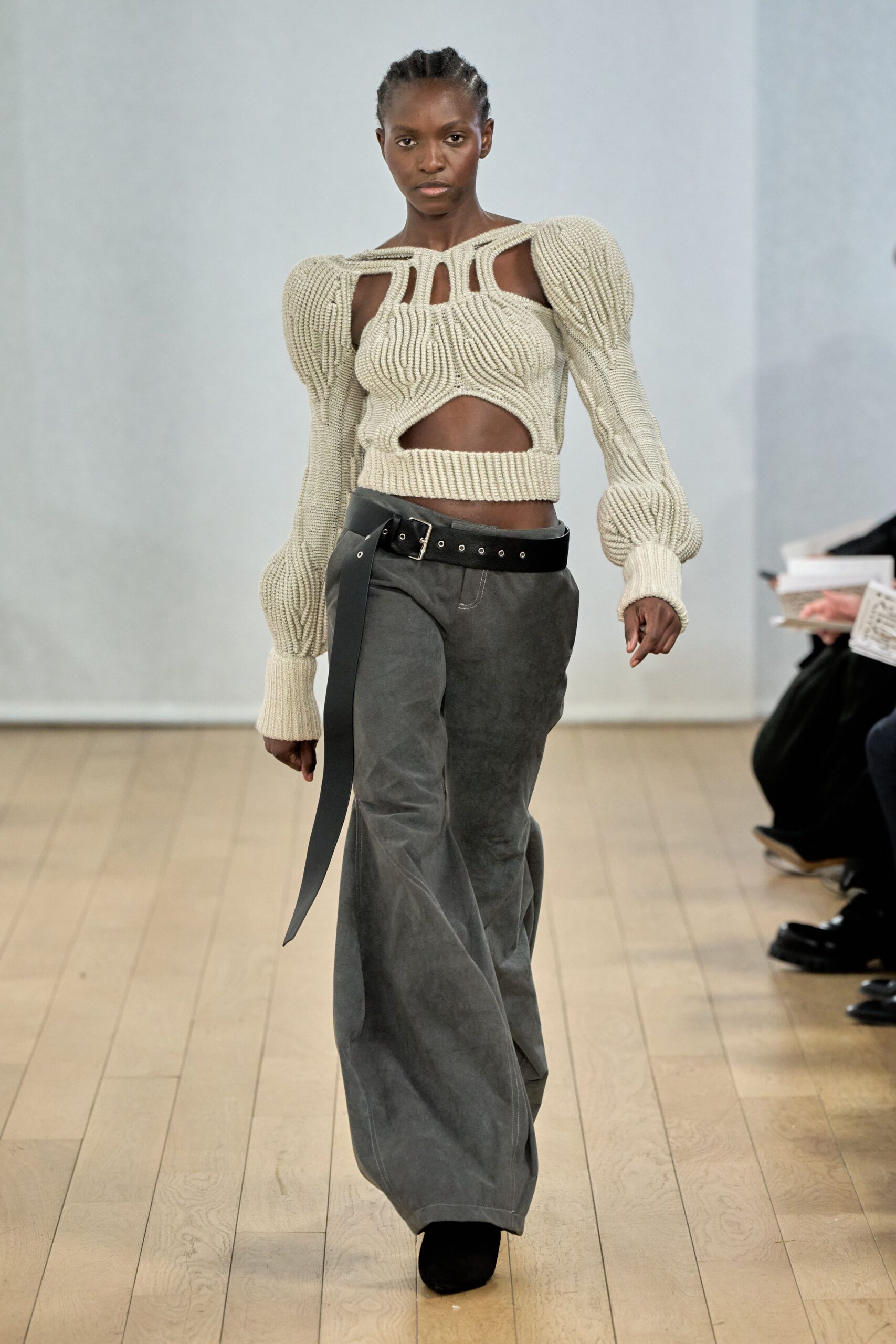beige ribbed sweater with gray pants