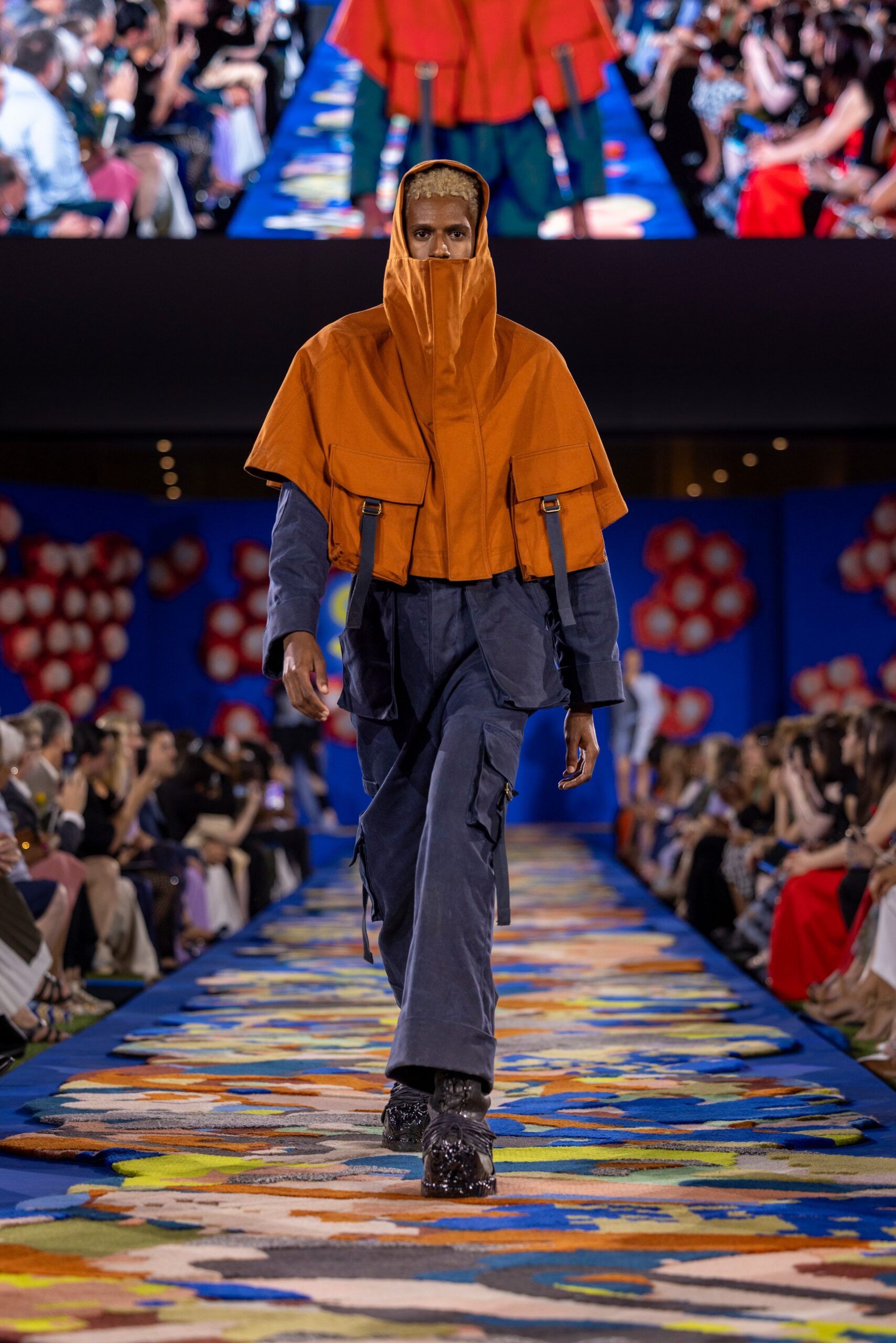 orange jacket blue cargo pants