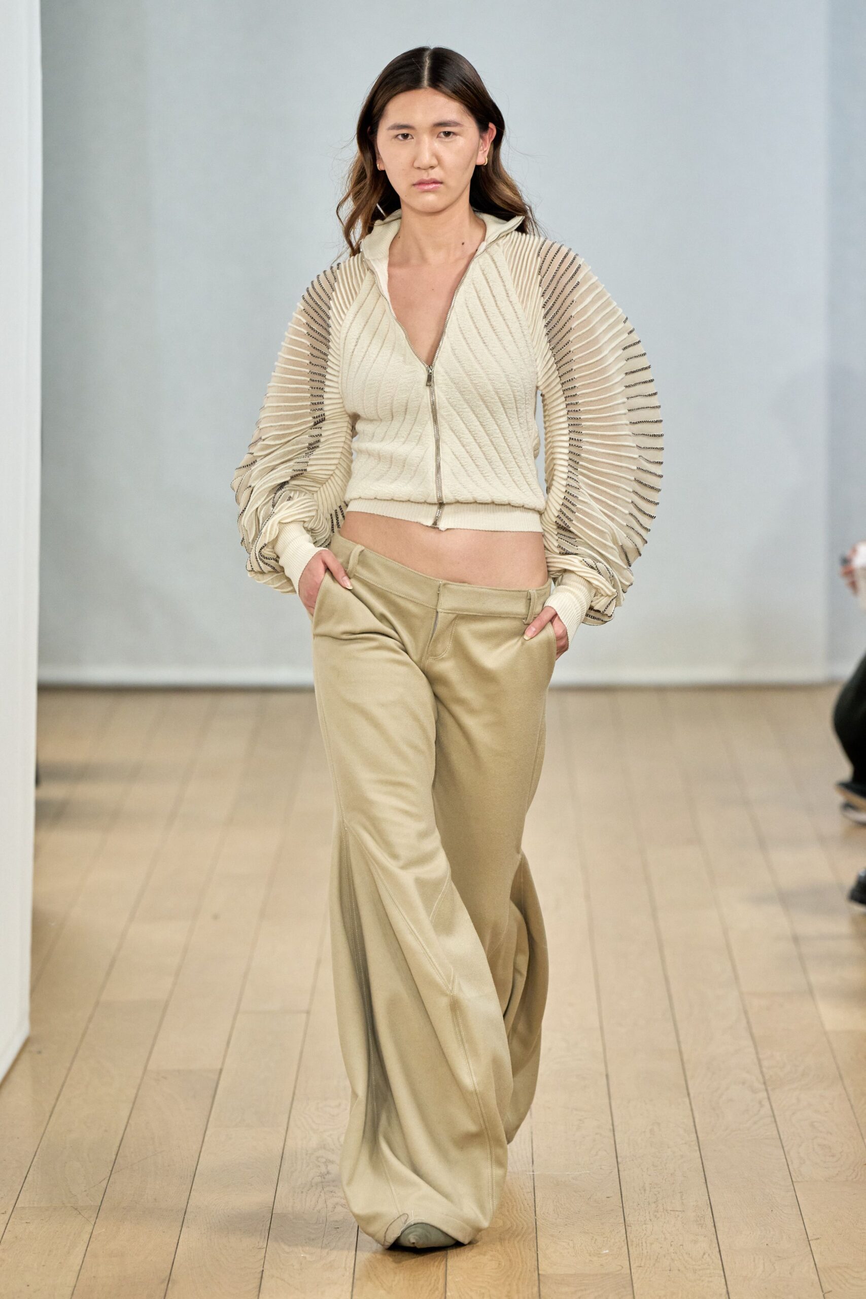 beige pleated top with wide-leg pants