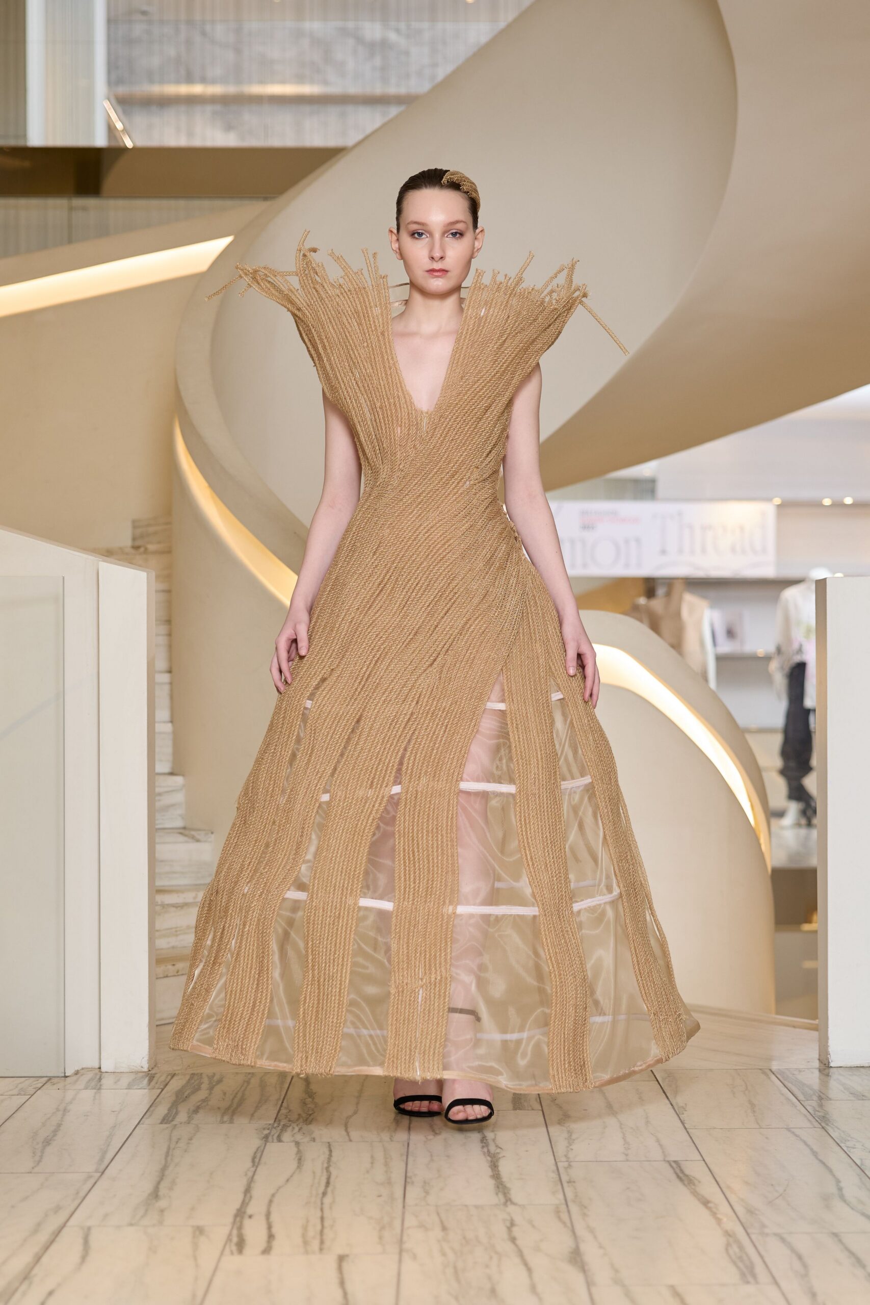 beige silk sleeveless v-neck fitted pleated draped gown