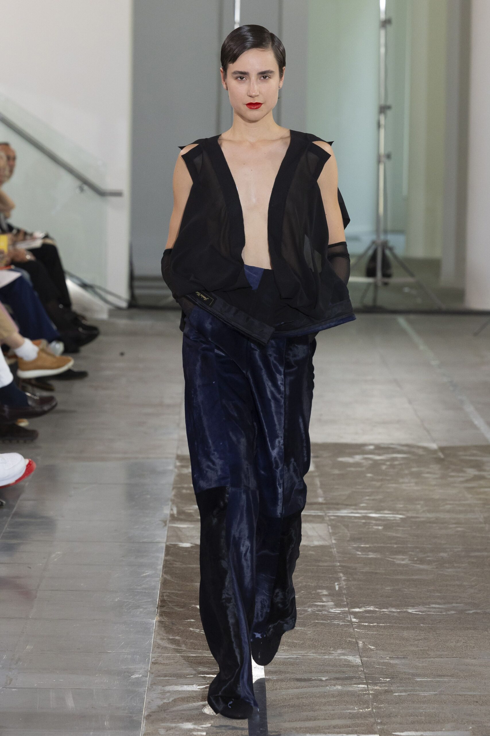 black silk sleeveless top and blue velvet pants