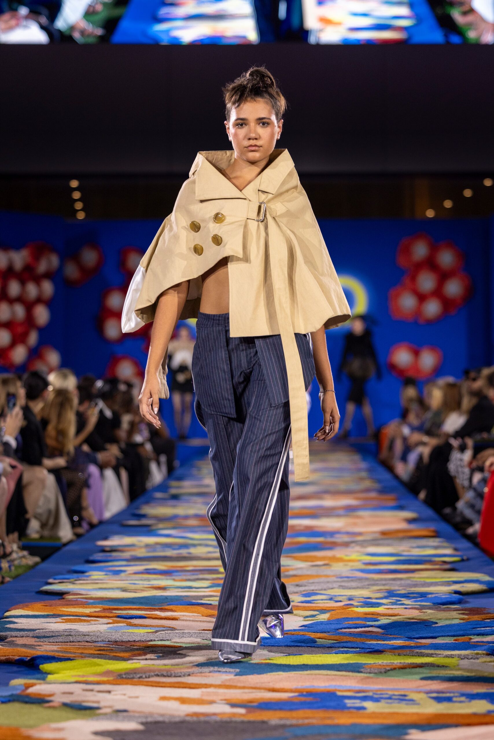 beige cape with blue pants