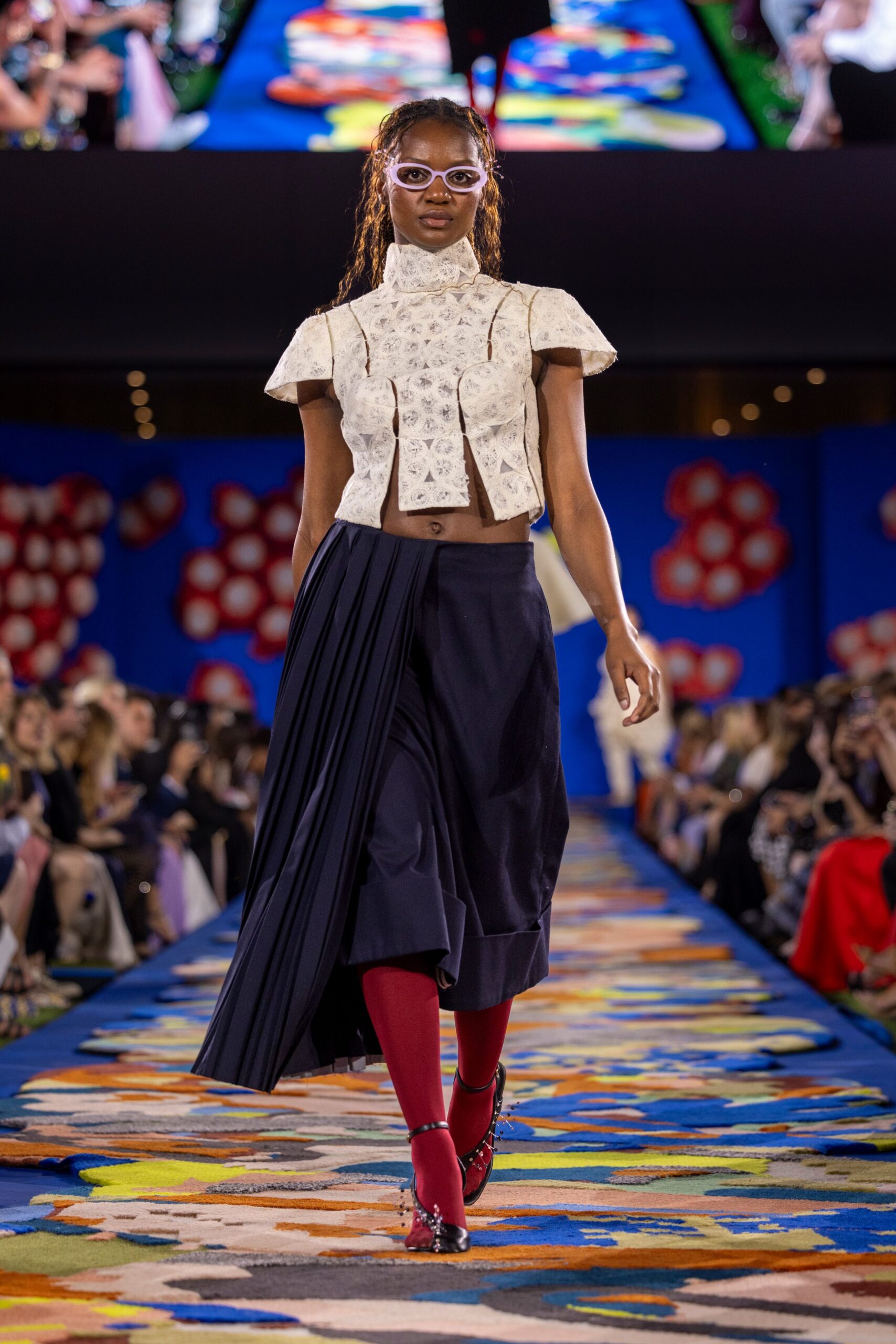 white embroidered top with navy skirt
