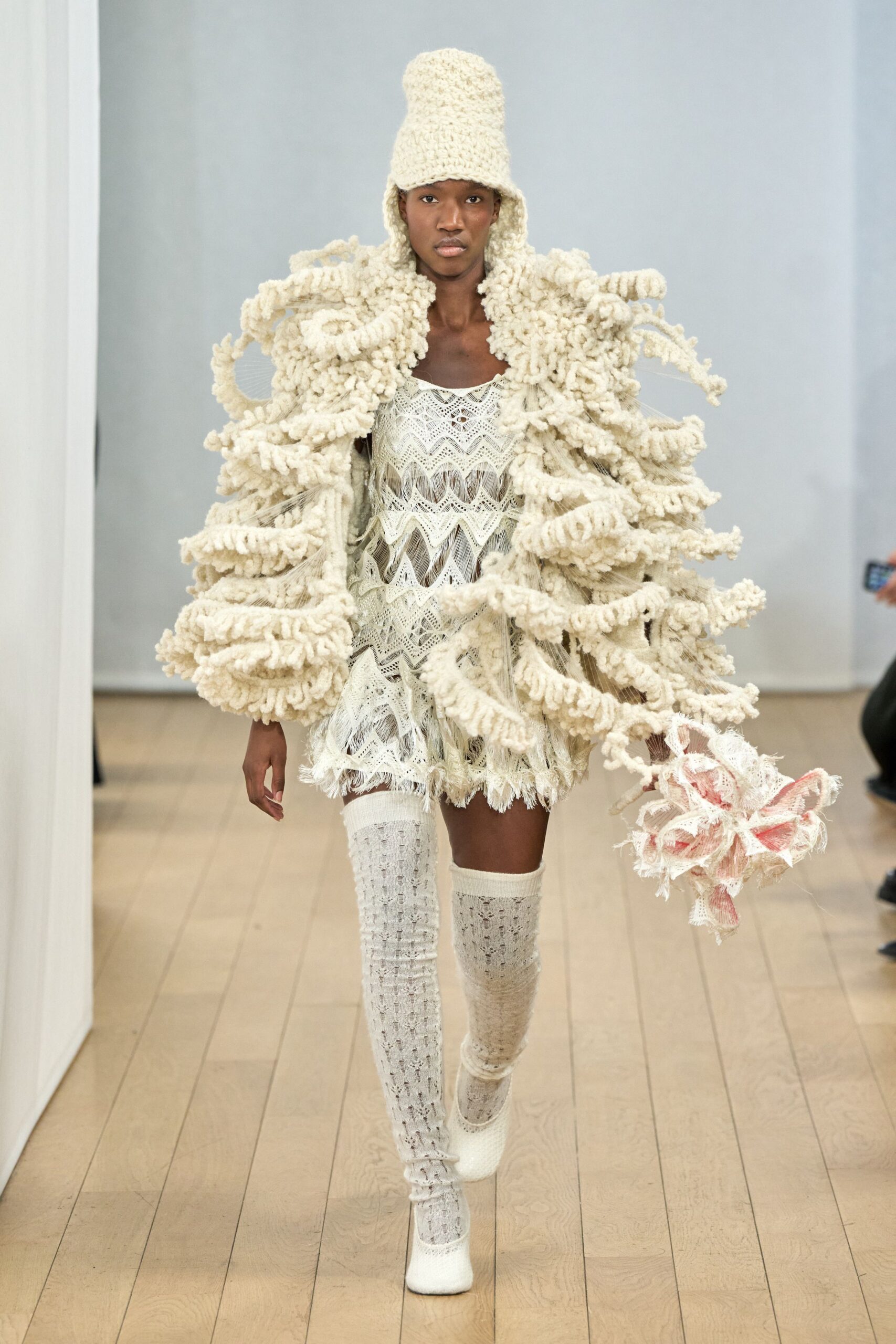 white ruffled mini dress with oversized coat