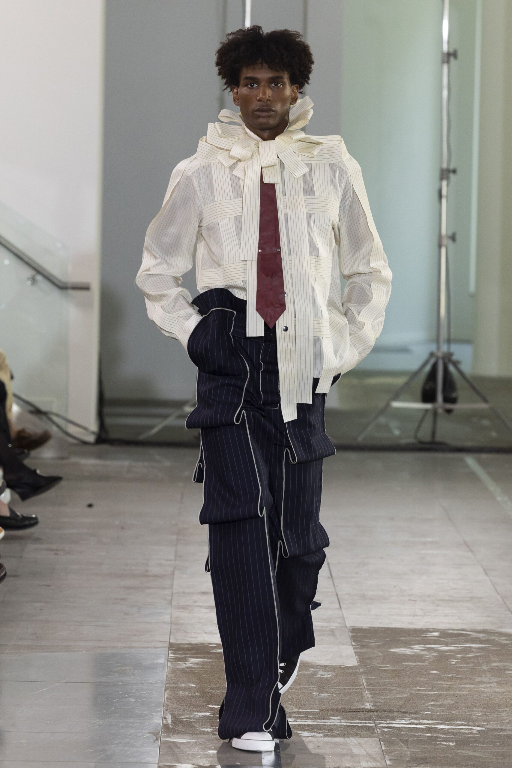 white pleated shirt with navy pants