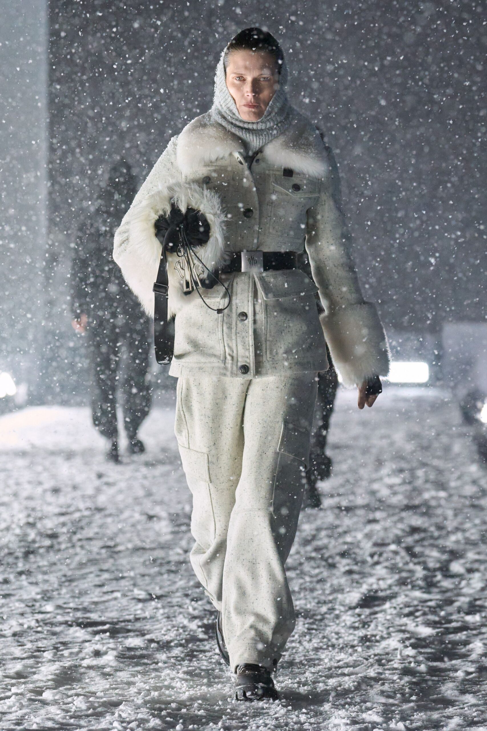 white faux-fur coat with cargo pants