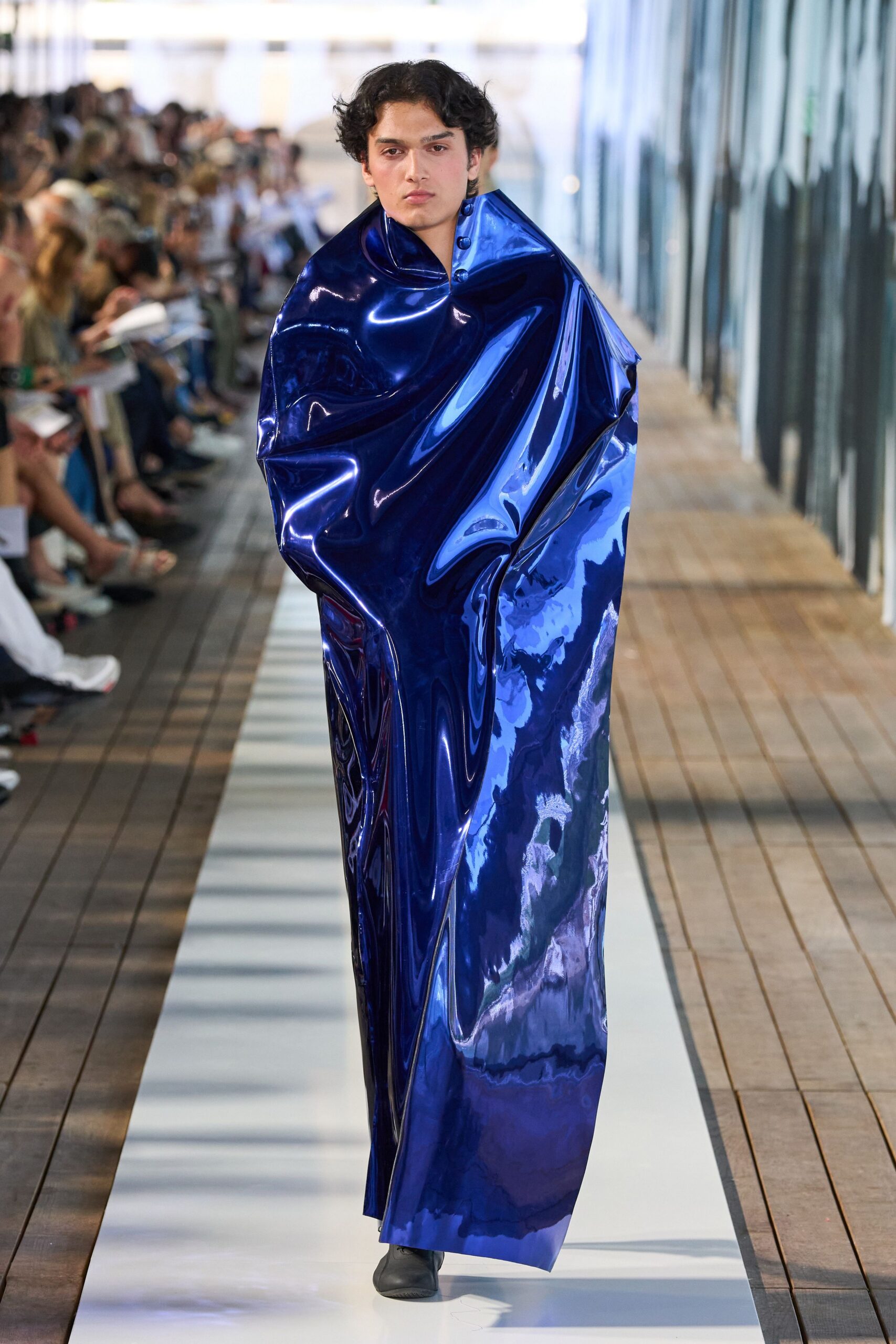 blue vinyl cape with black shoes