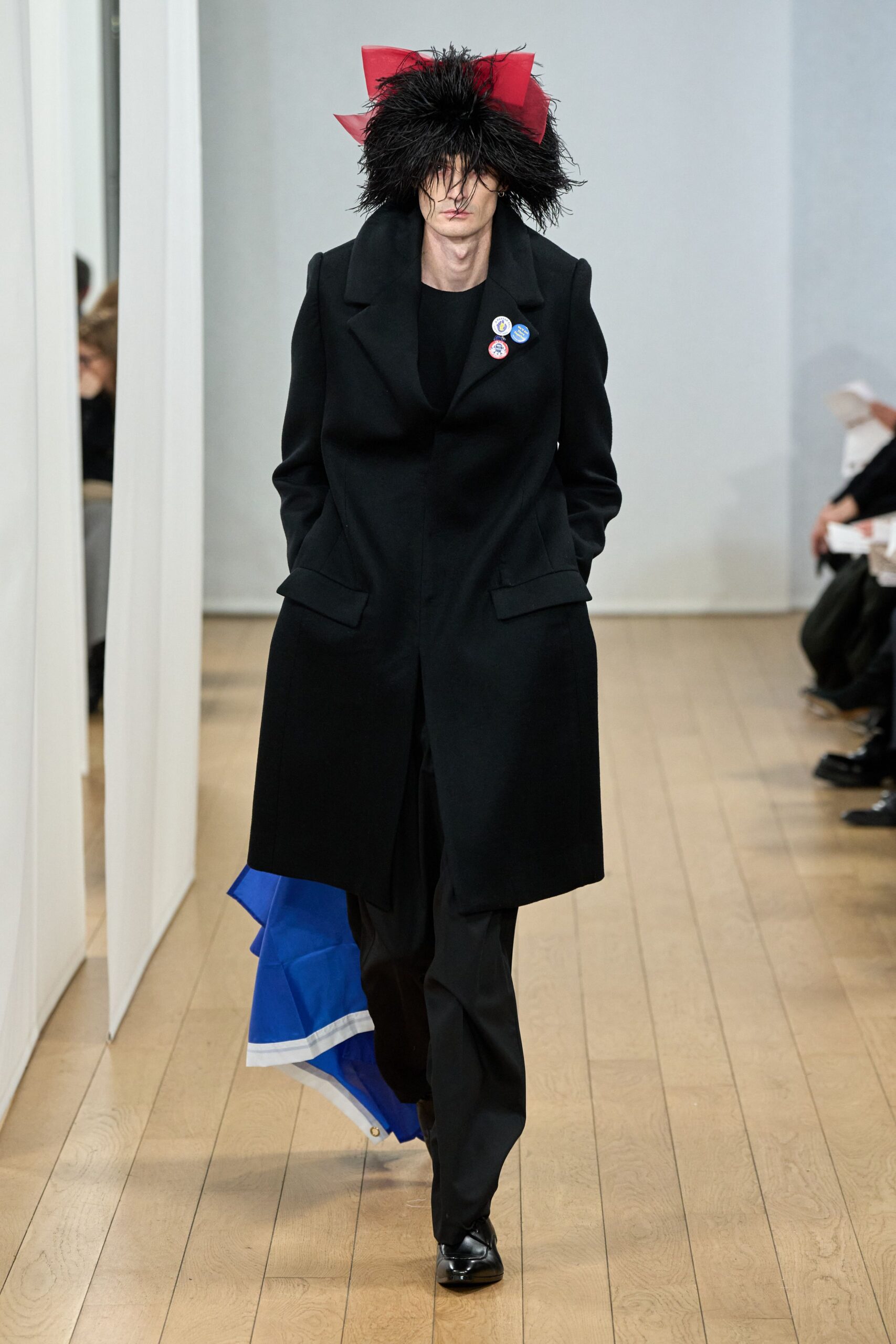 black wool coat with fringed hat