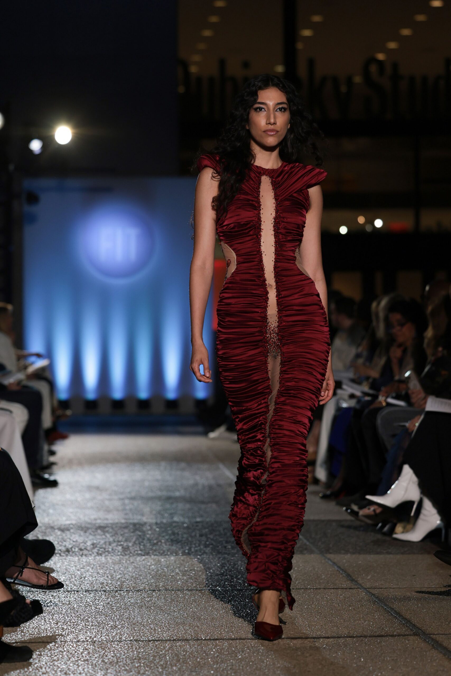 red ruched gown with heels