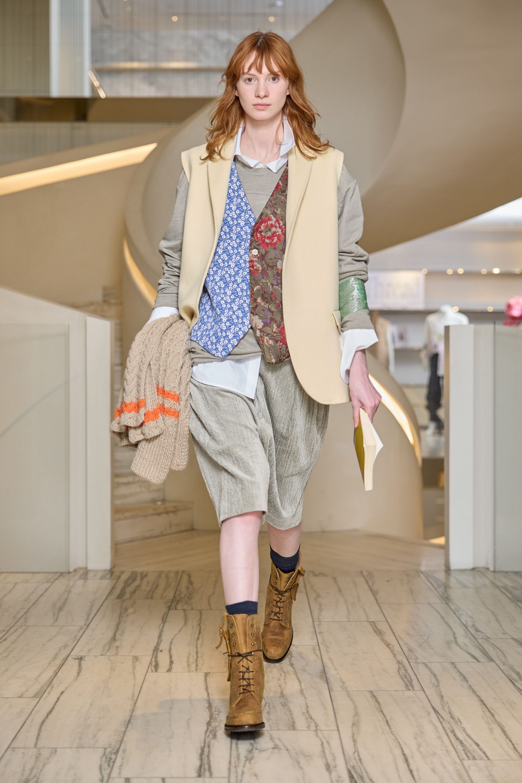 beige jacket with brown vest