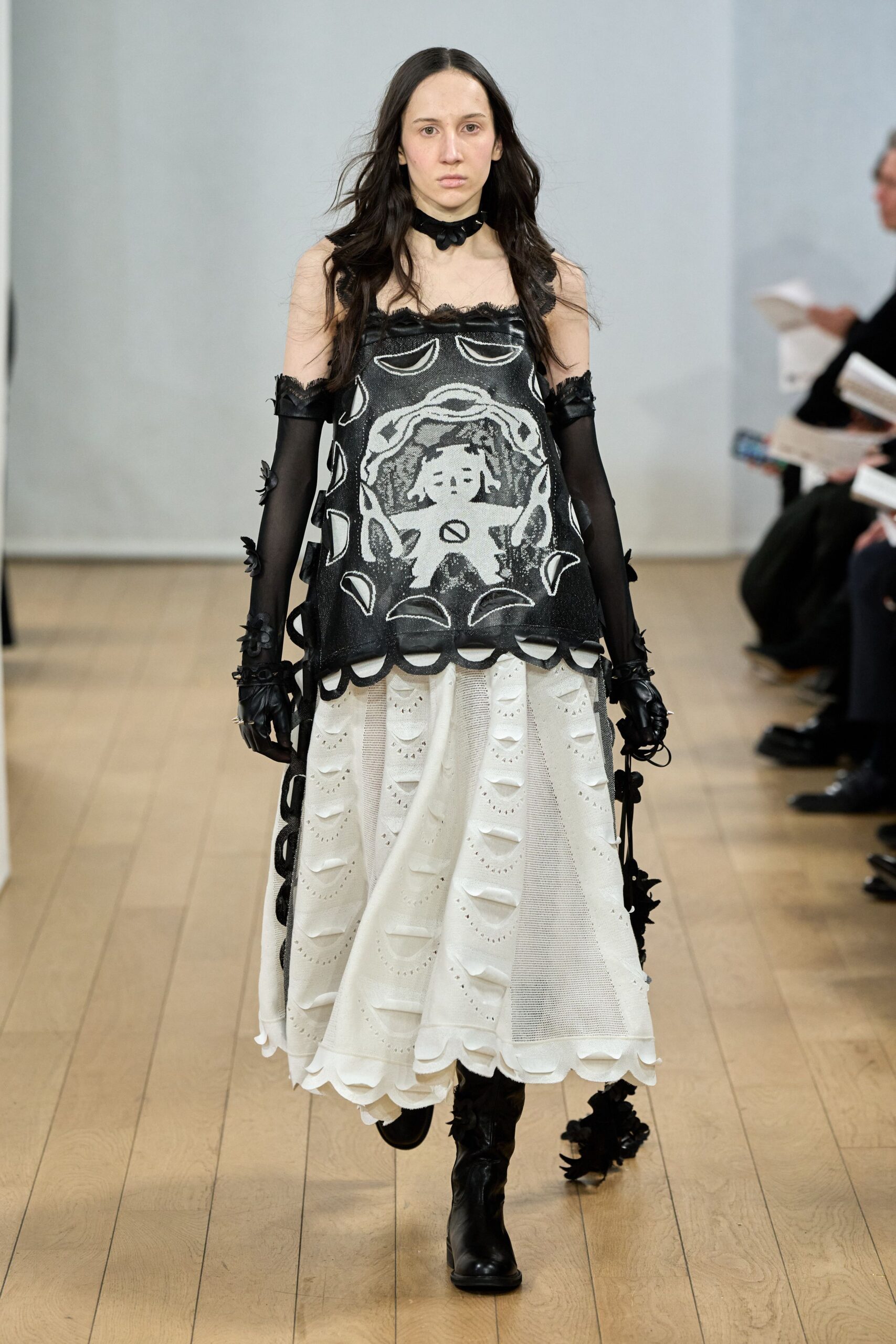 black embroidered top white pleated skirt