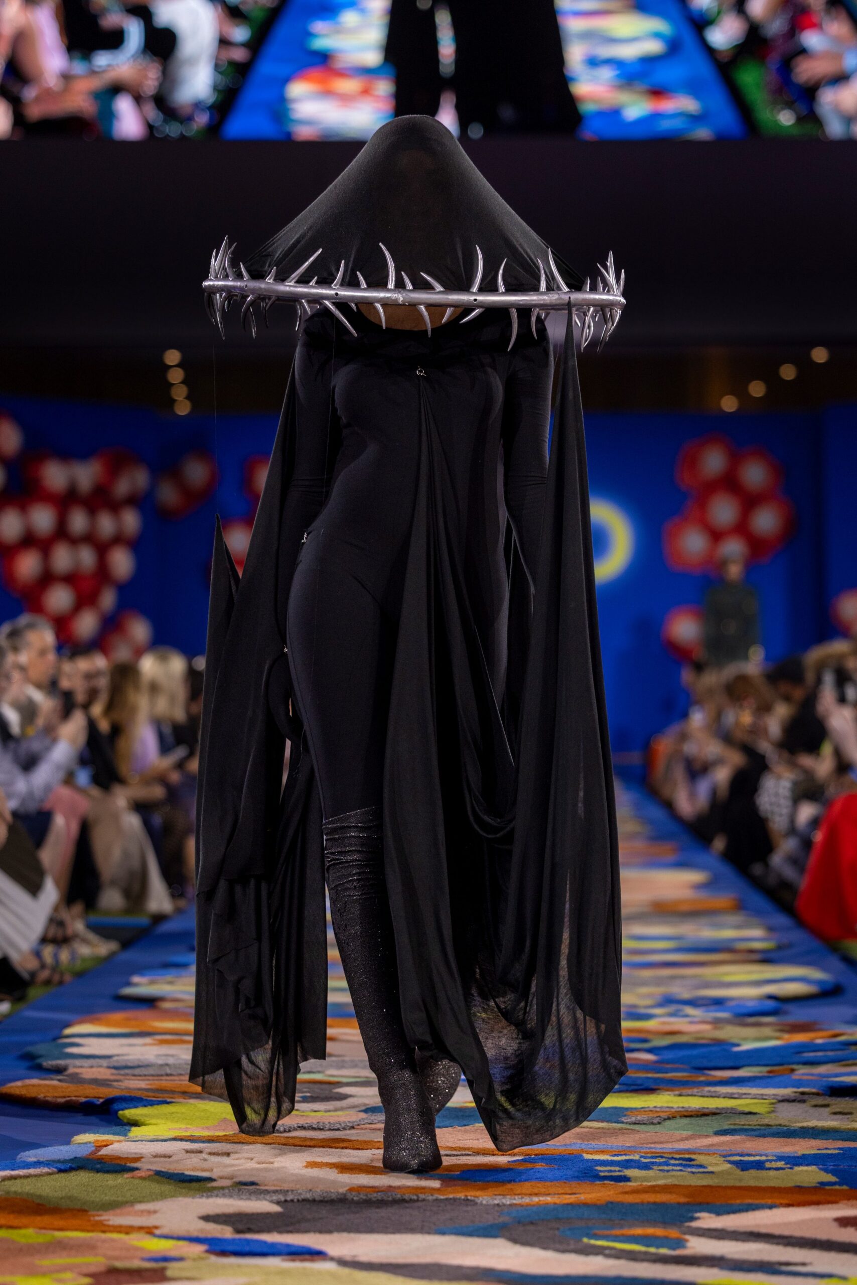 black flowing maxi dress with boots