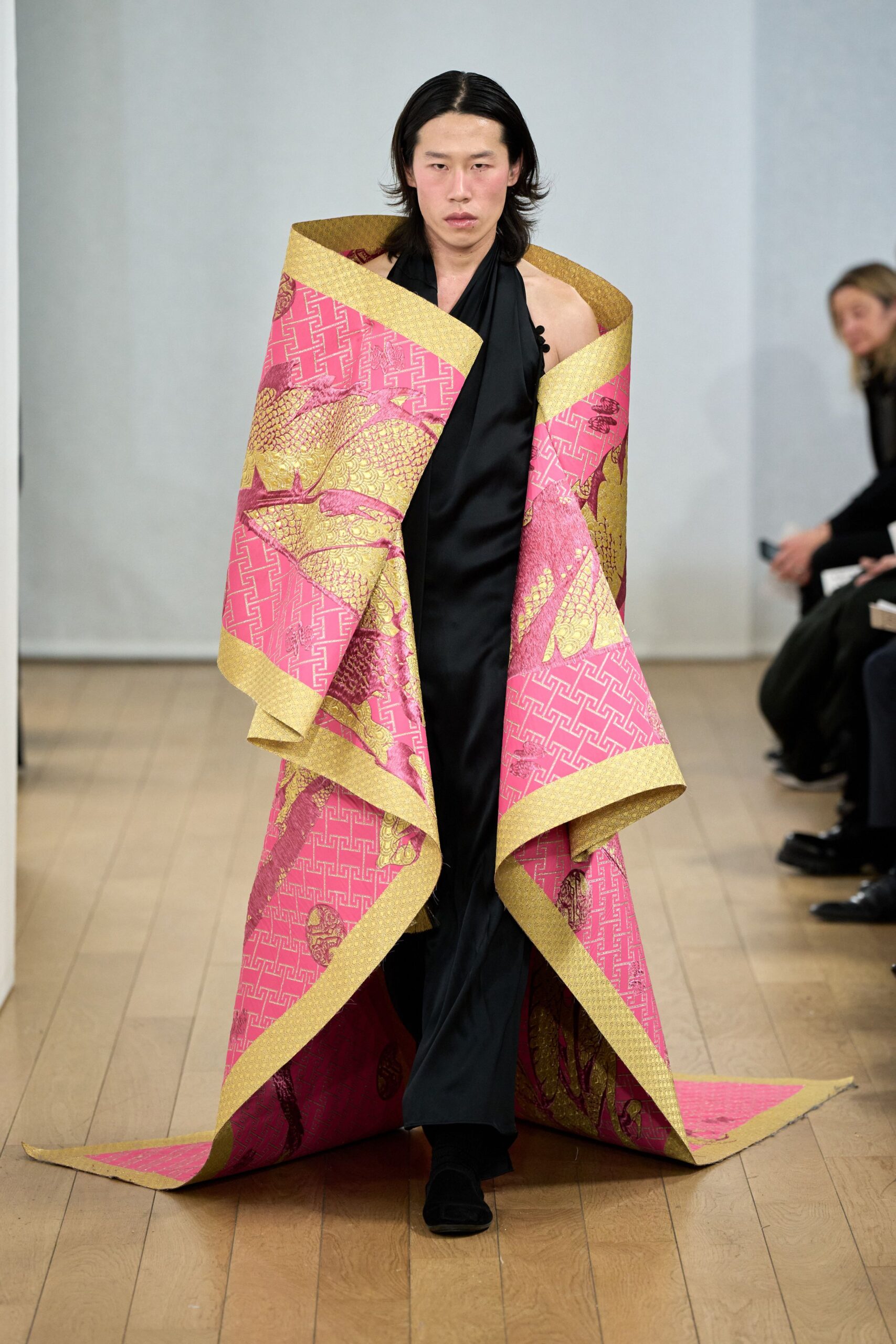 pink gold embroidered cape black gown