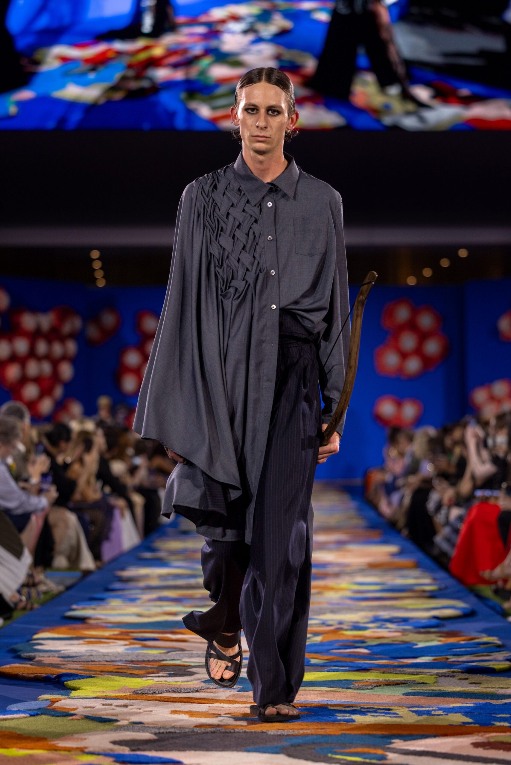 gray cape black pants